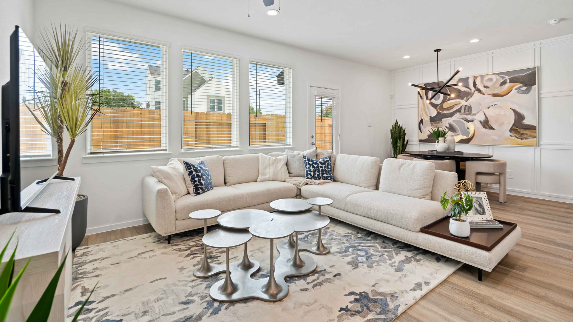 spacious living room opens to dining area