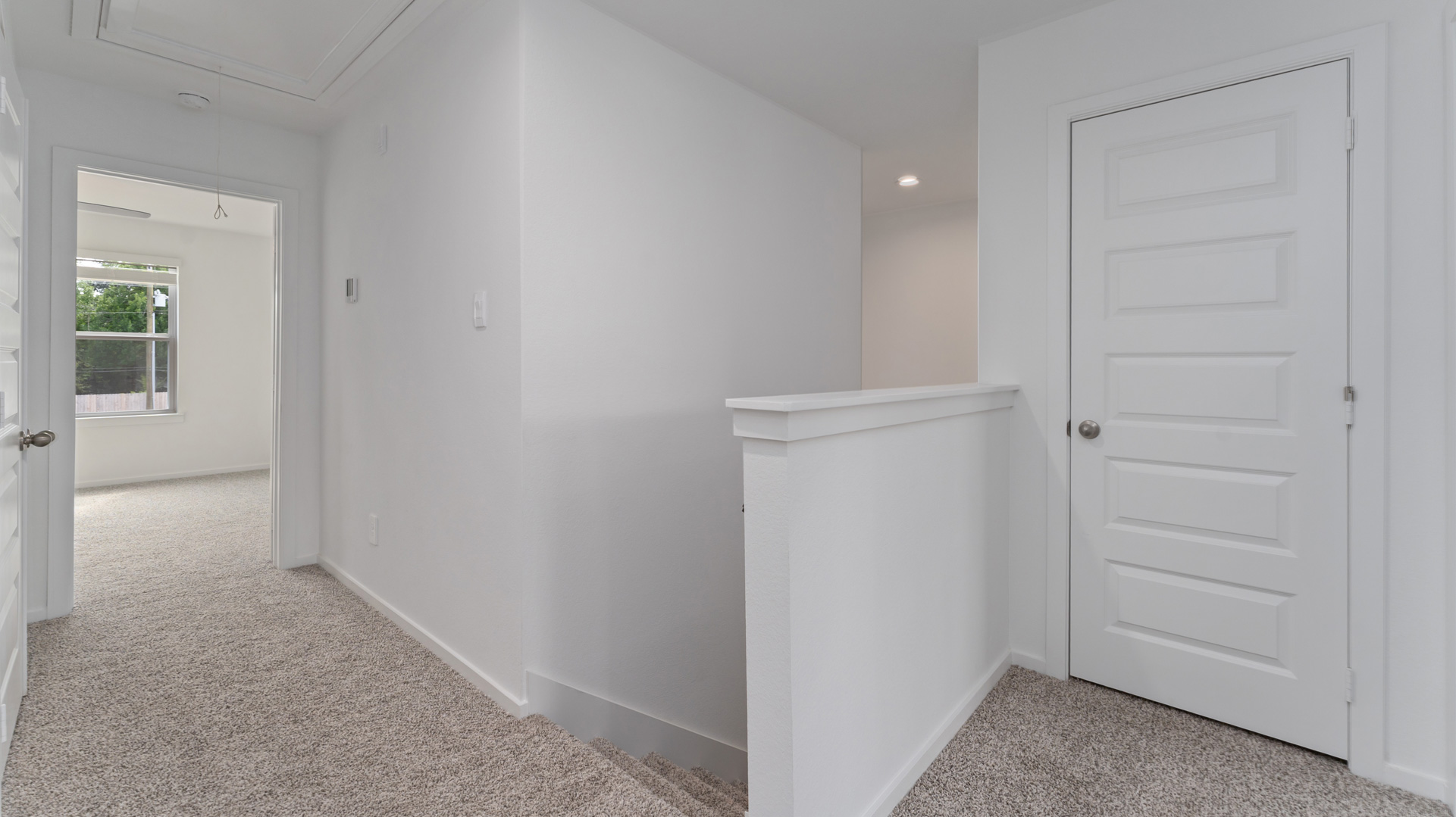 stairs leading up to the second floor where comfortable carpet floors are throughout the second story