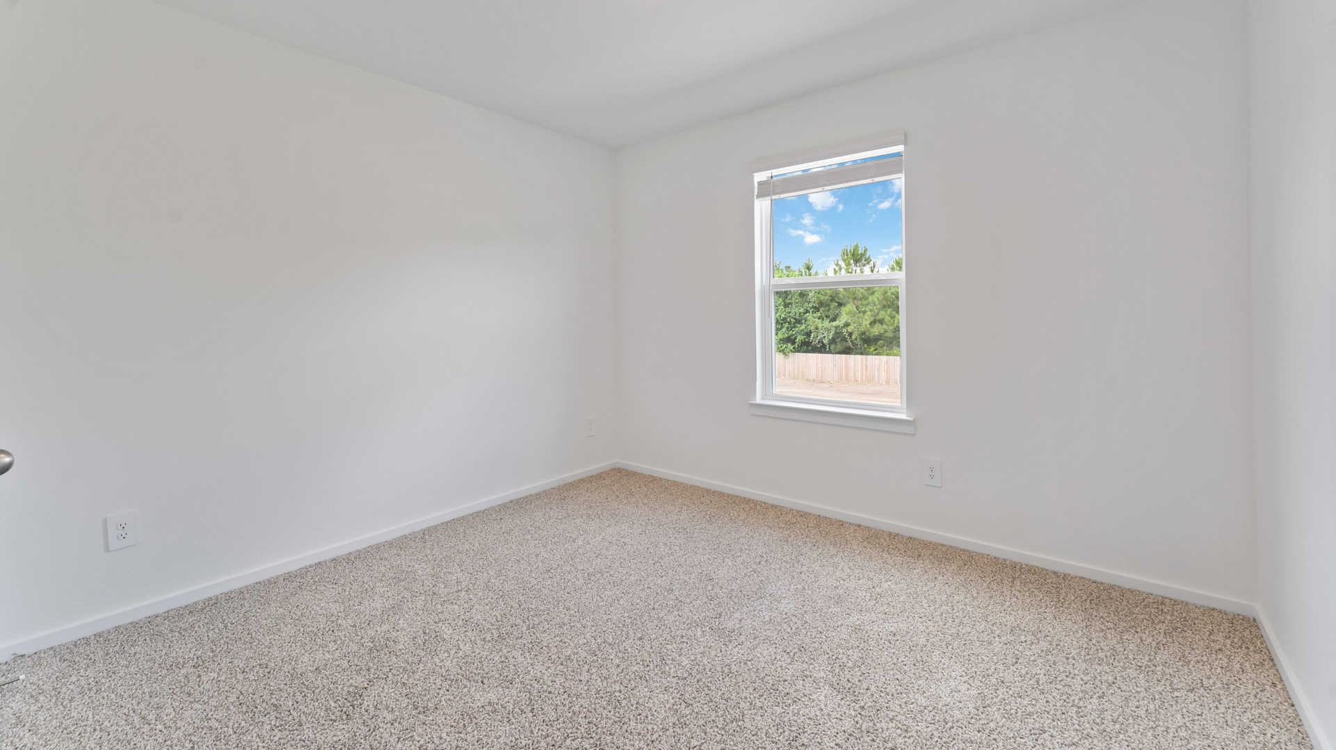 a third bedroom has a large single window for natural light