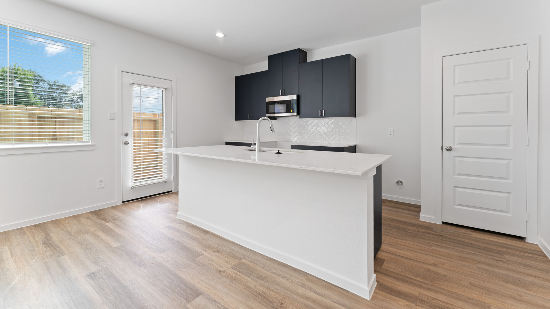 spacious kitchen with large island perfect for bar seating