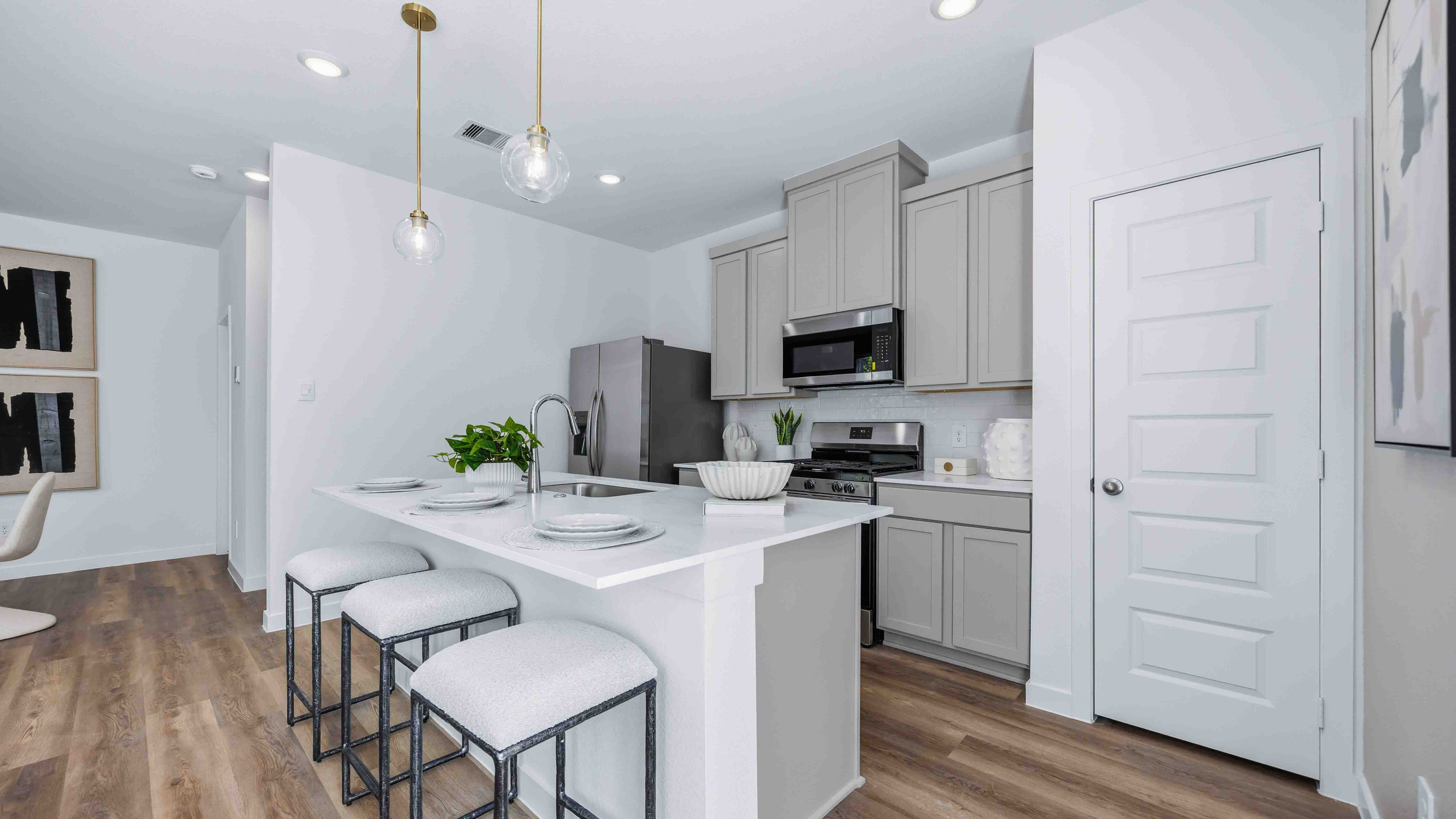 kitchen area with an island for additional storage and seating