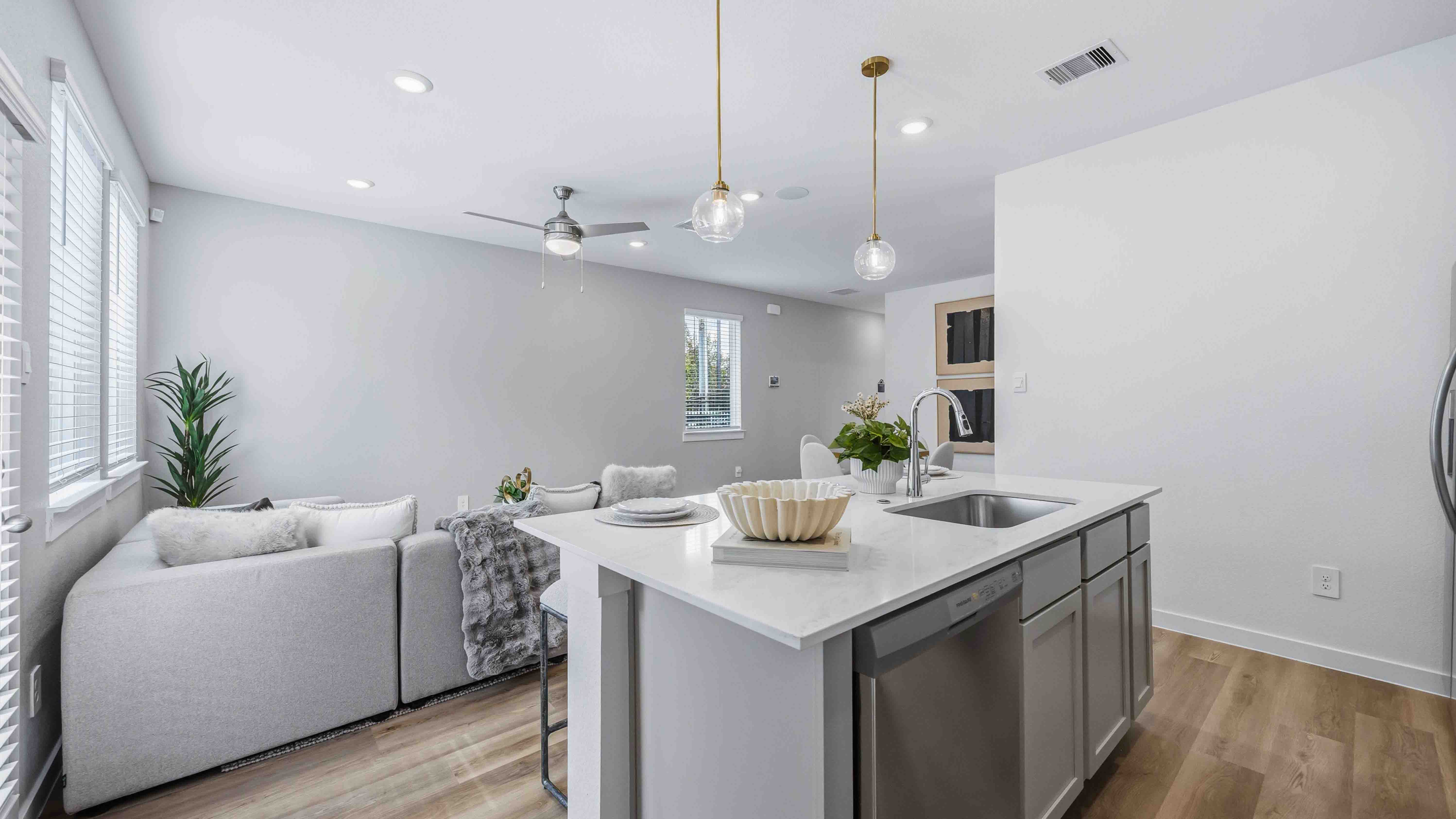 kitchen island with dishwater and kitchen sink