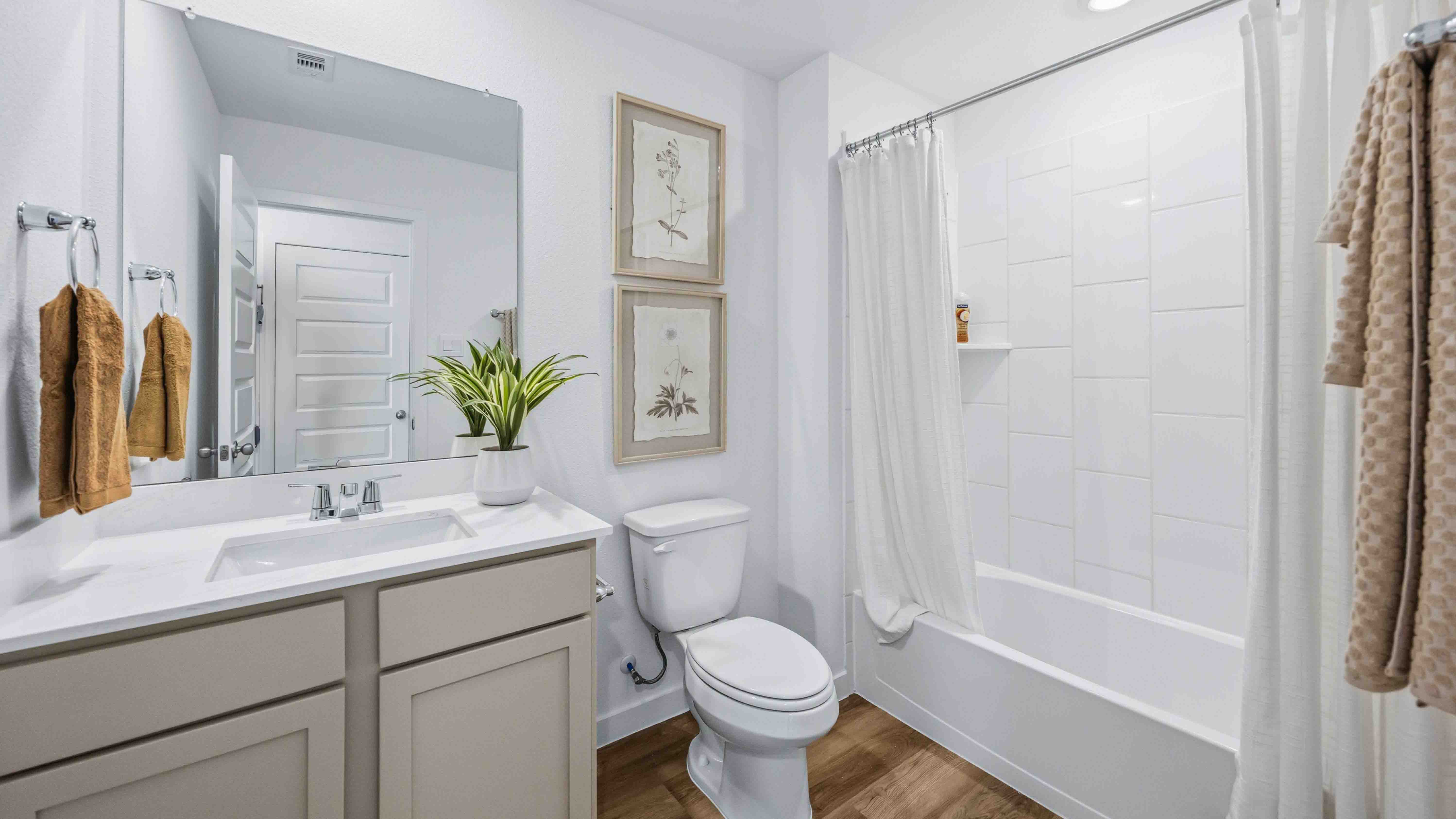 secondary bathroom with a standing tub and one sink vanity