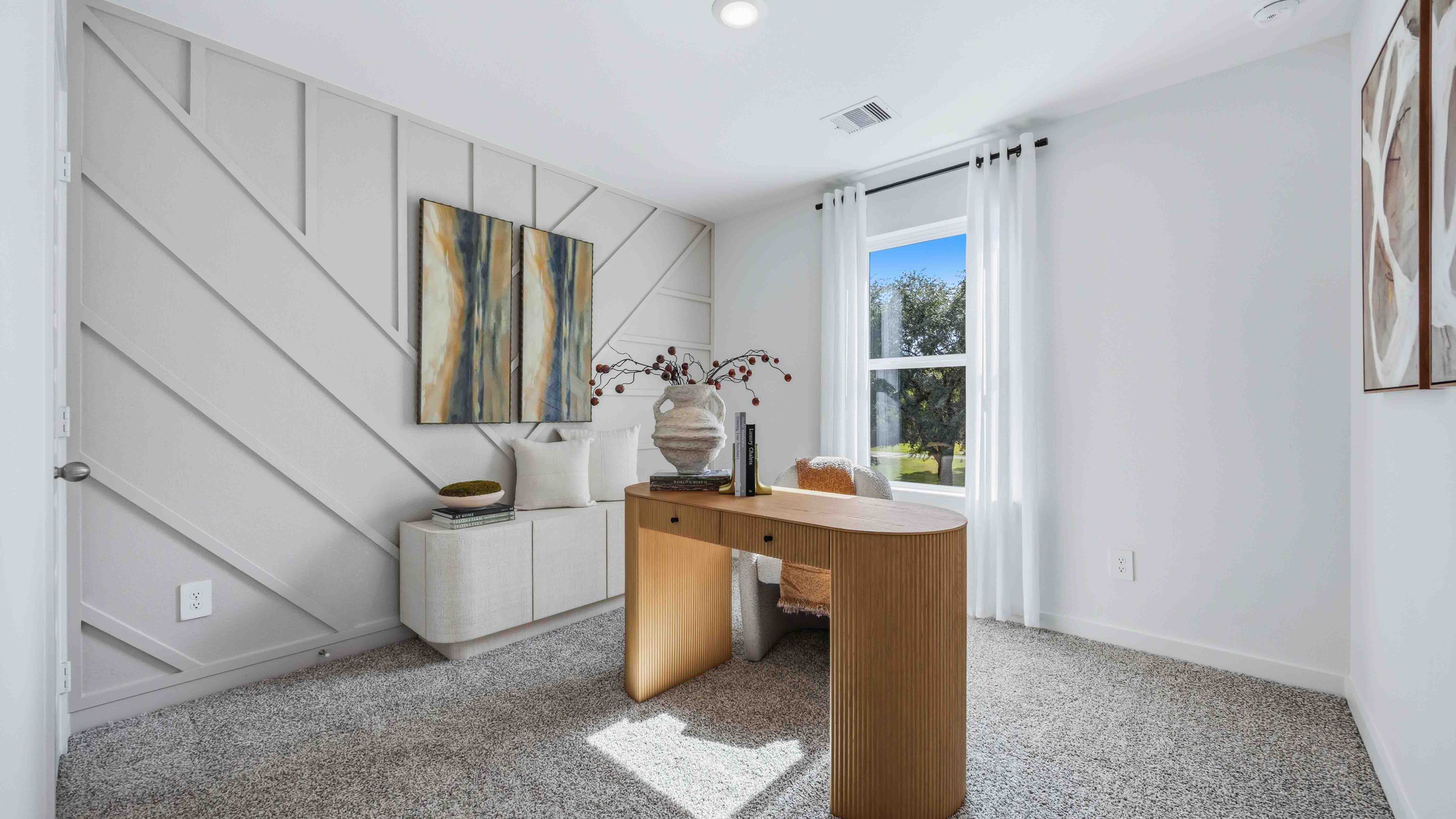 home office/third bedroom has light neutral walls and carpet flooring