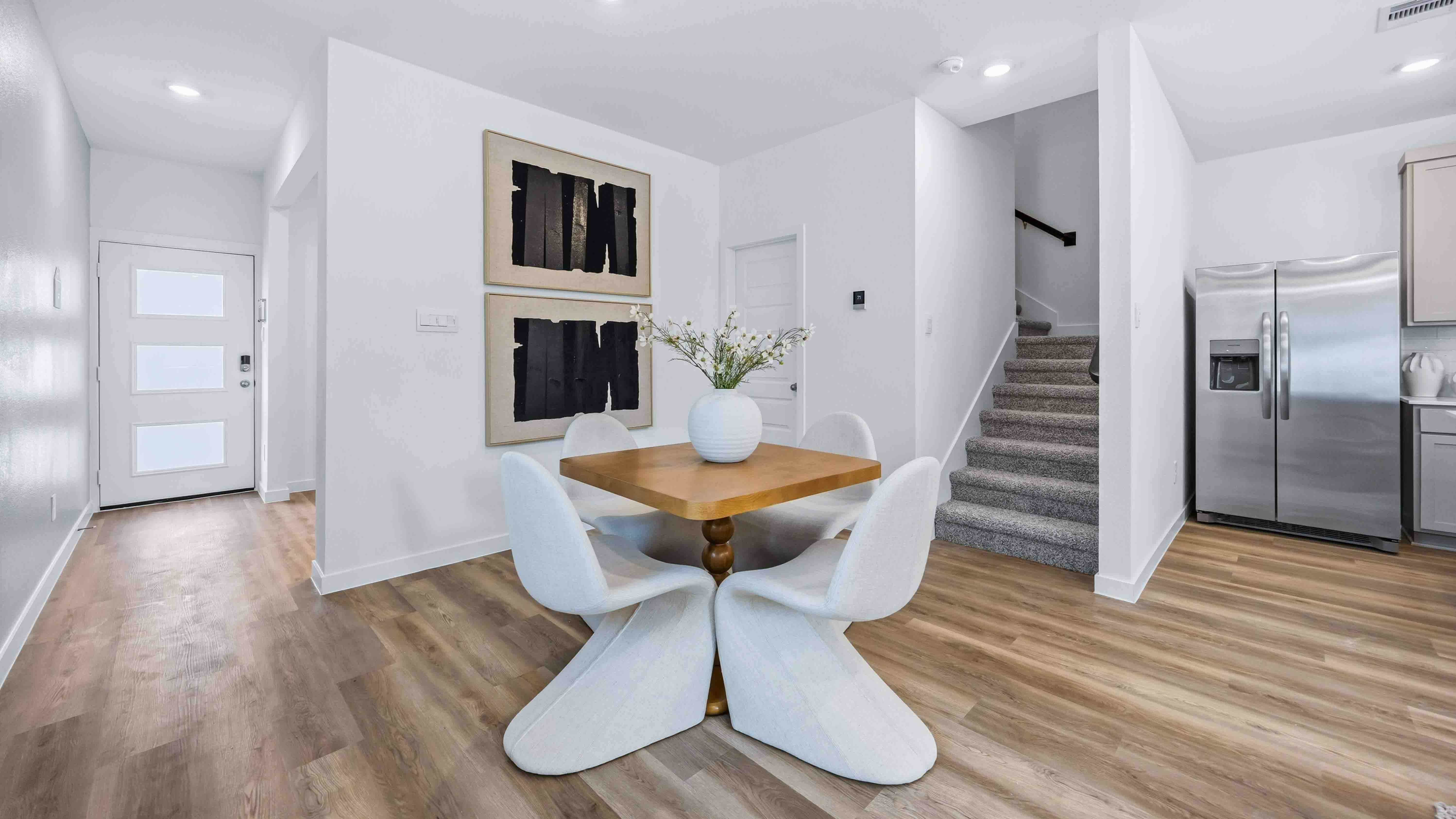 dining area with natural lighting that overlooks the backyard