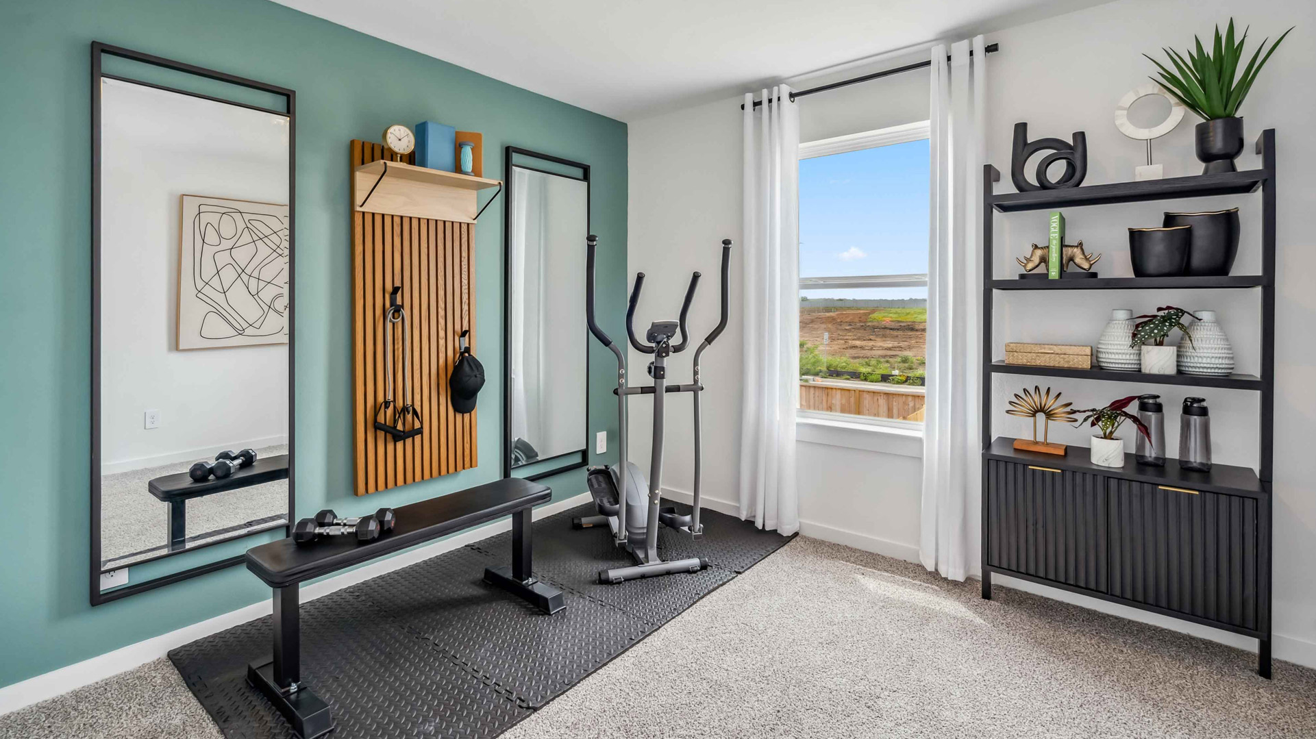 third bedroom, shown as a home gym, also located updstairs