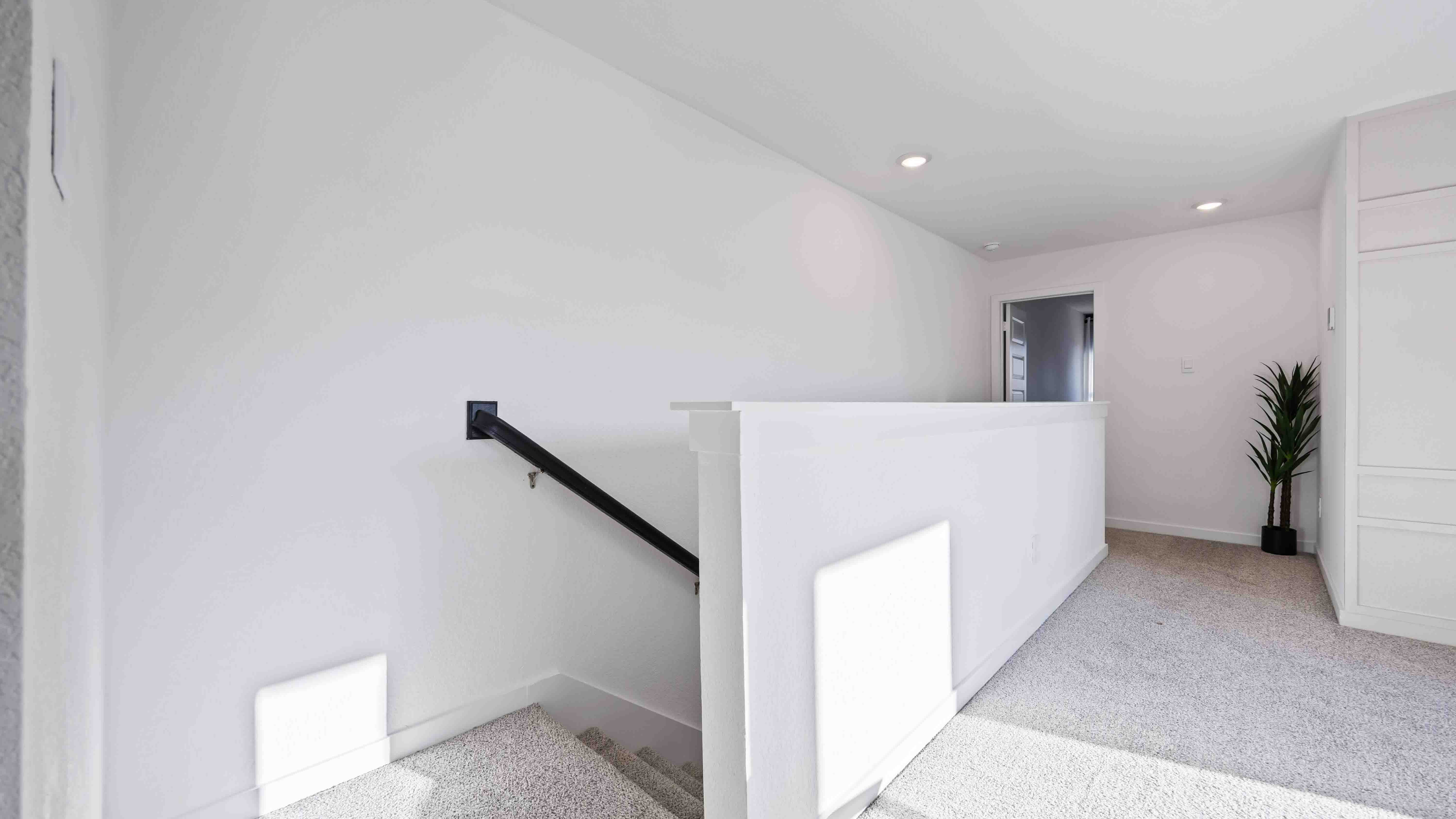 staircase access from the second floor off the additional living area upstairs