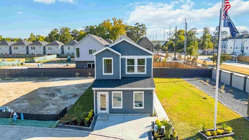outside exterior of the two-story home with a two-car garage
