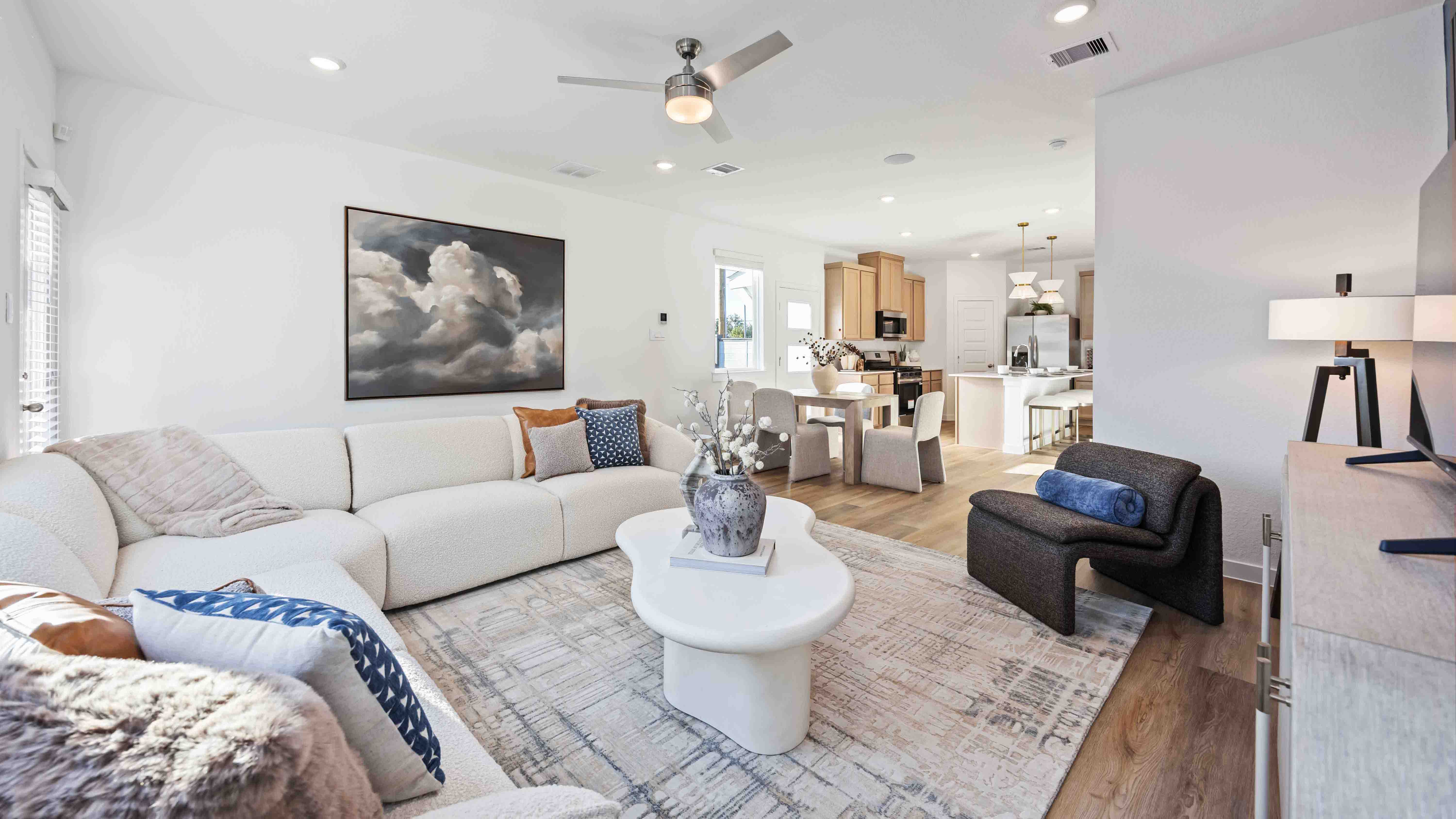 living room with room for coffee table, a chair, and a sectional L shaped couch
