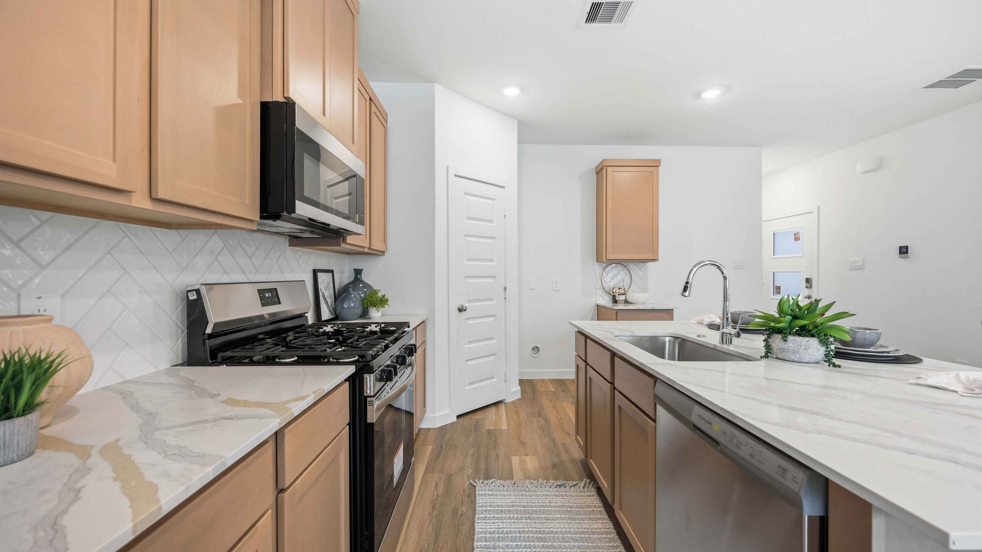 kitchen island - a spacious island offers bar seating perfect for dining or entertaining