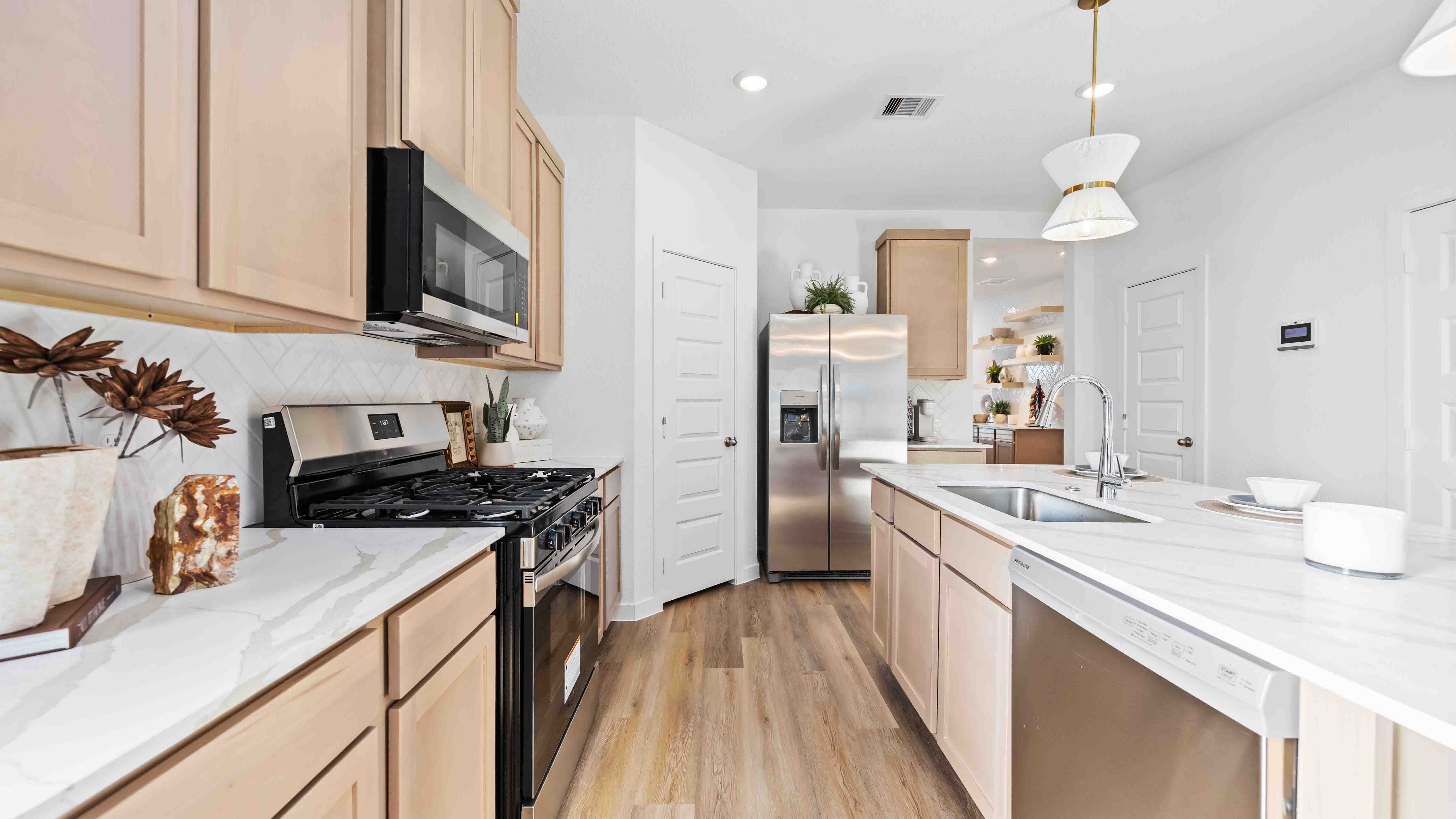 kitchen island - a spacious island offers bar seating perfect for dining or entertaining