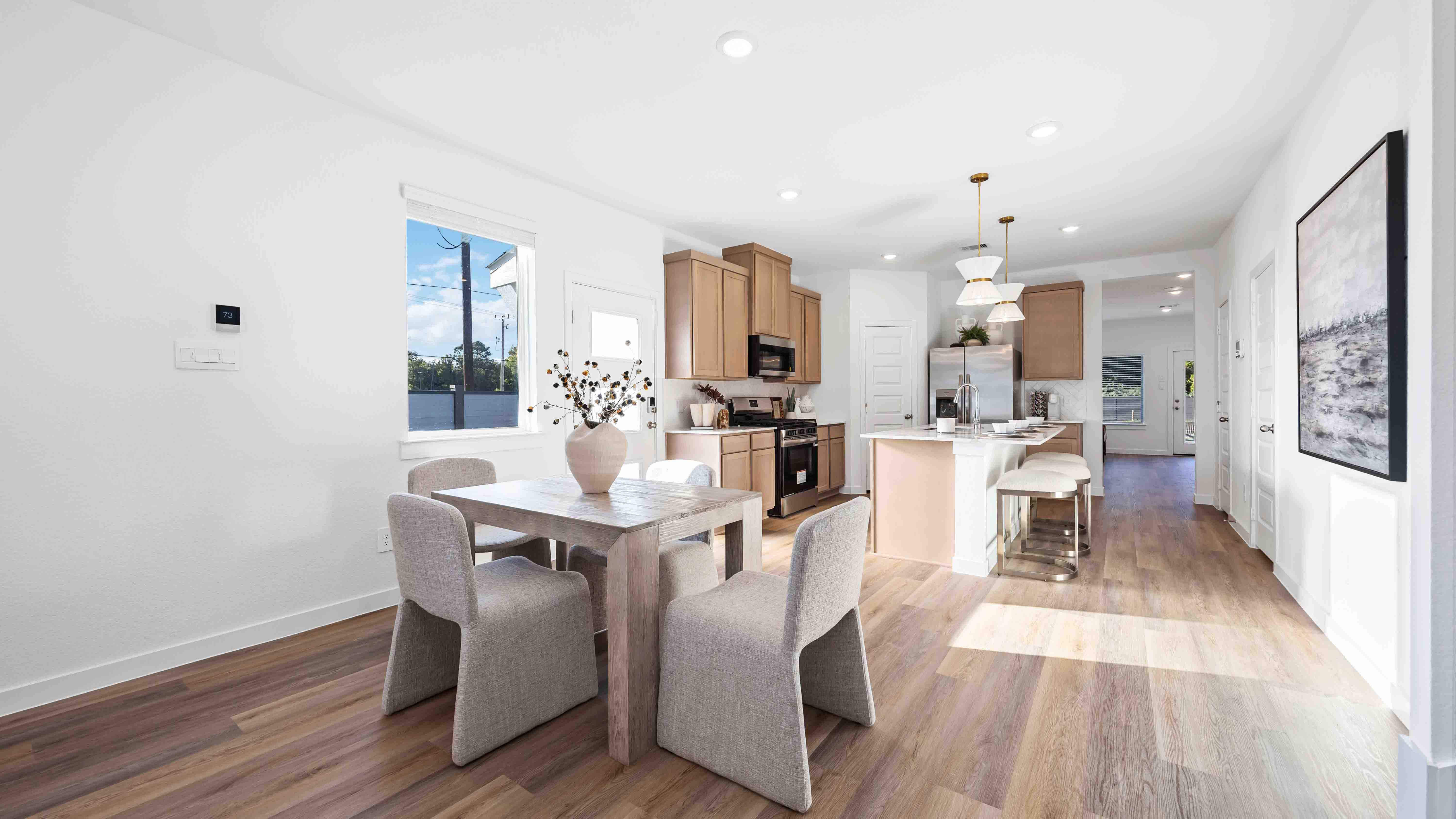 dining area with natural lighting that overlooks the backyard