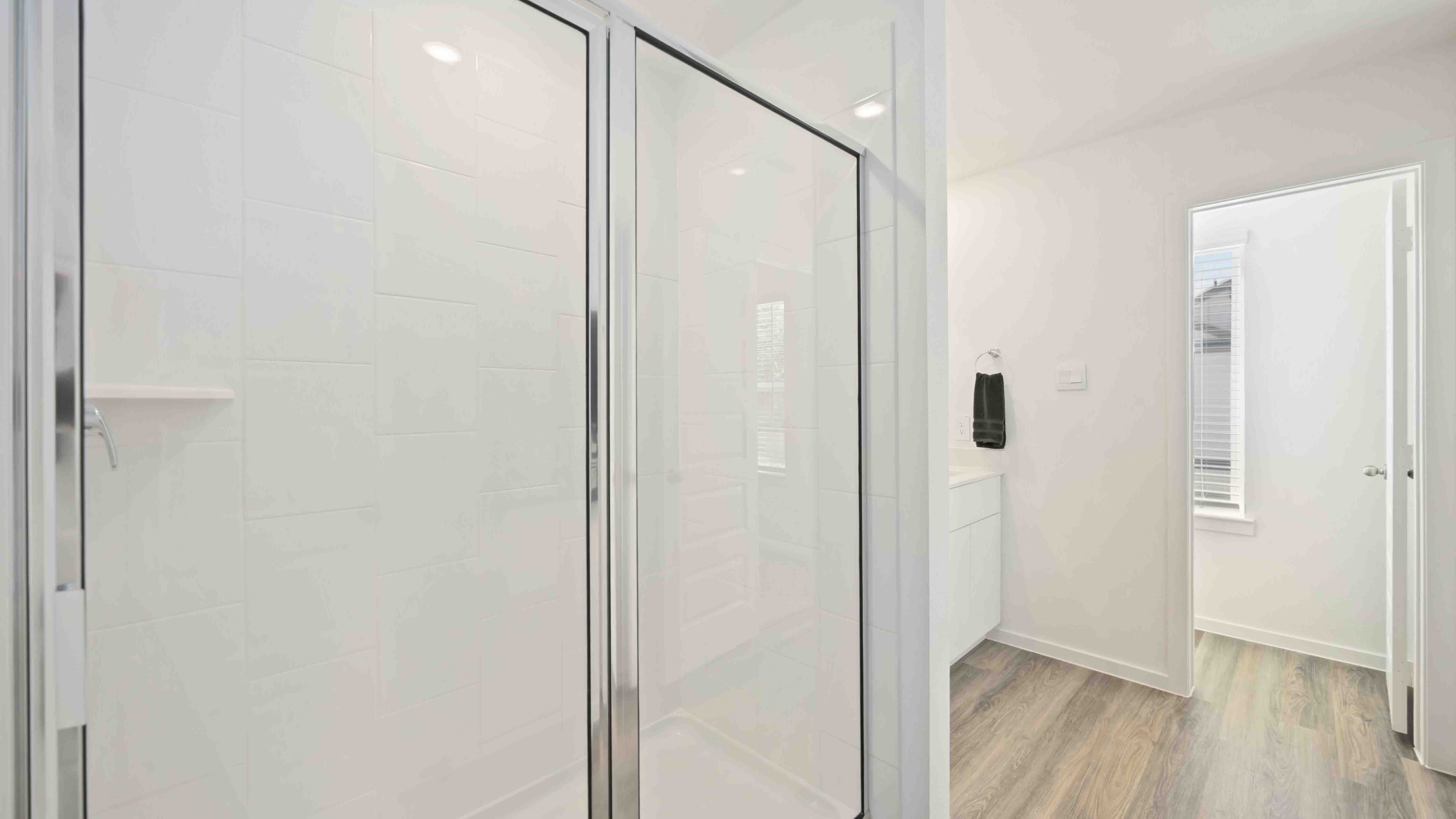 the primary bathroom with a standing shower