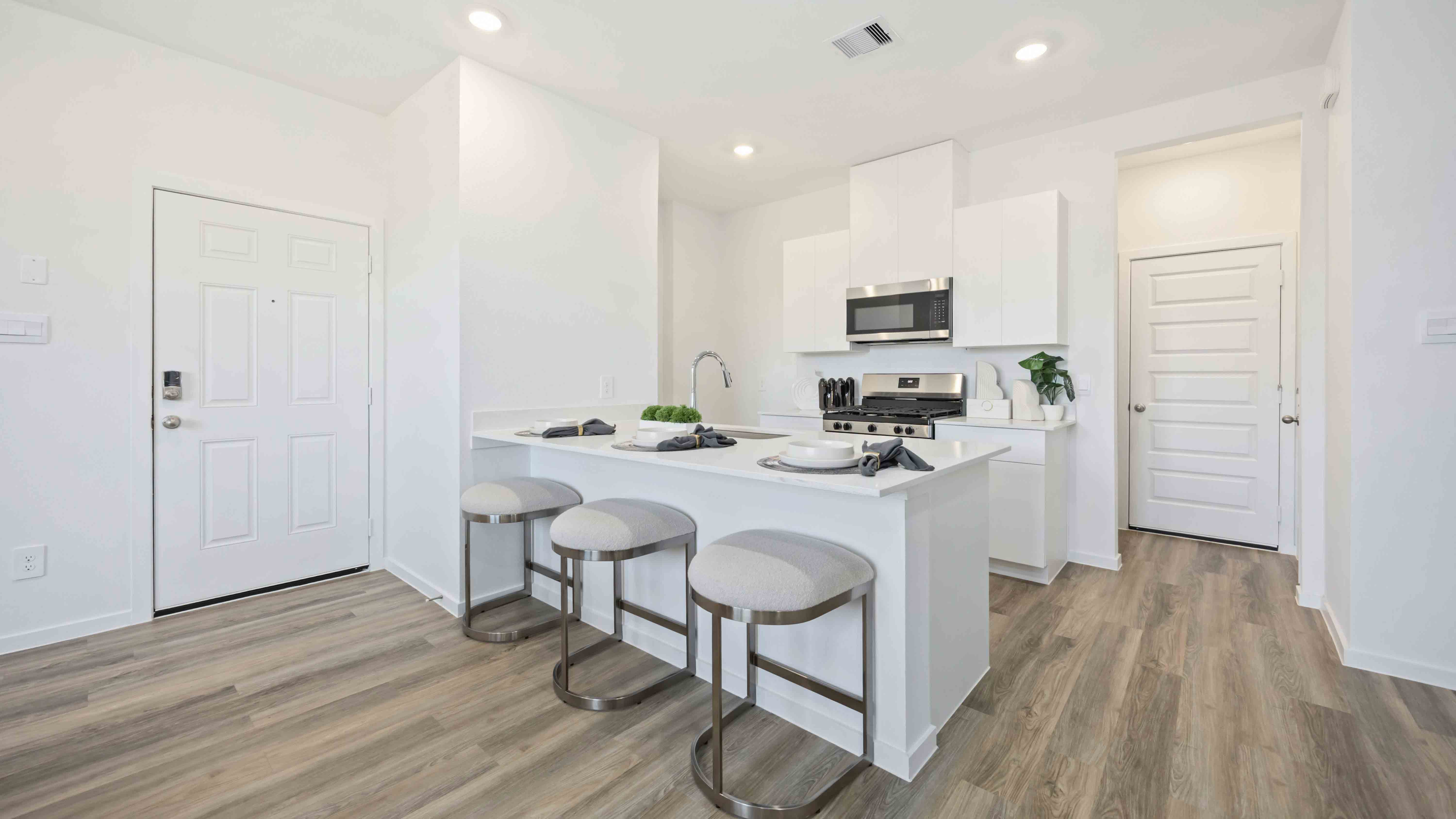 kitchen island - a spacious island offers bar seating perfect for dining or entertaining
