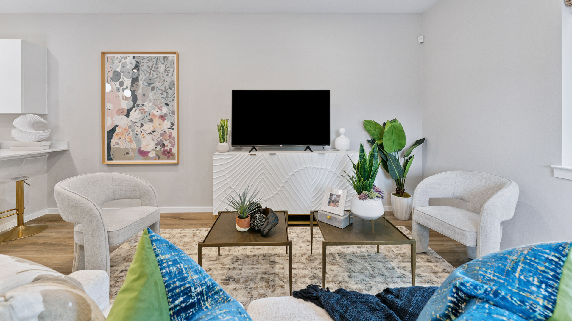 light neutral walls and revwood laminate flooring in the living room