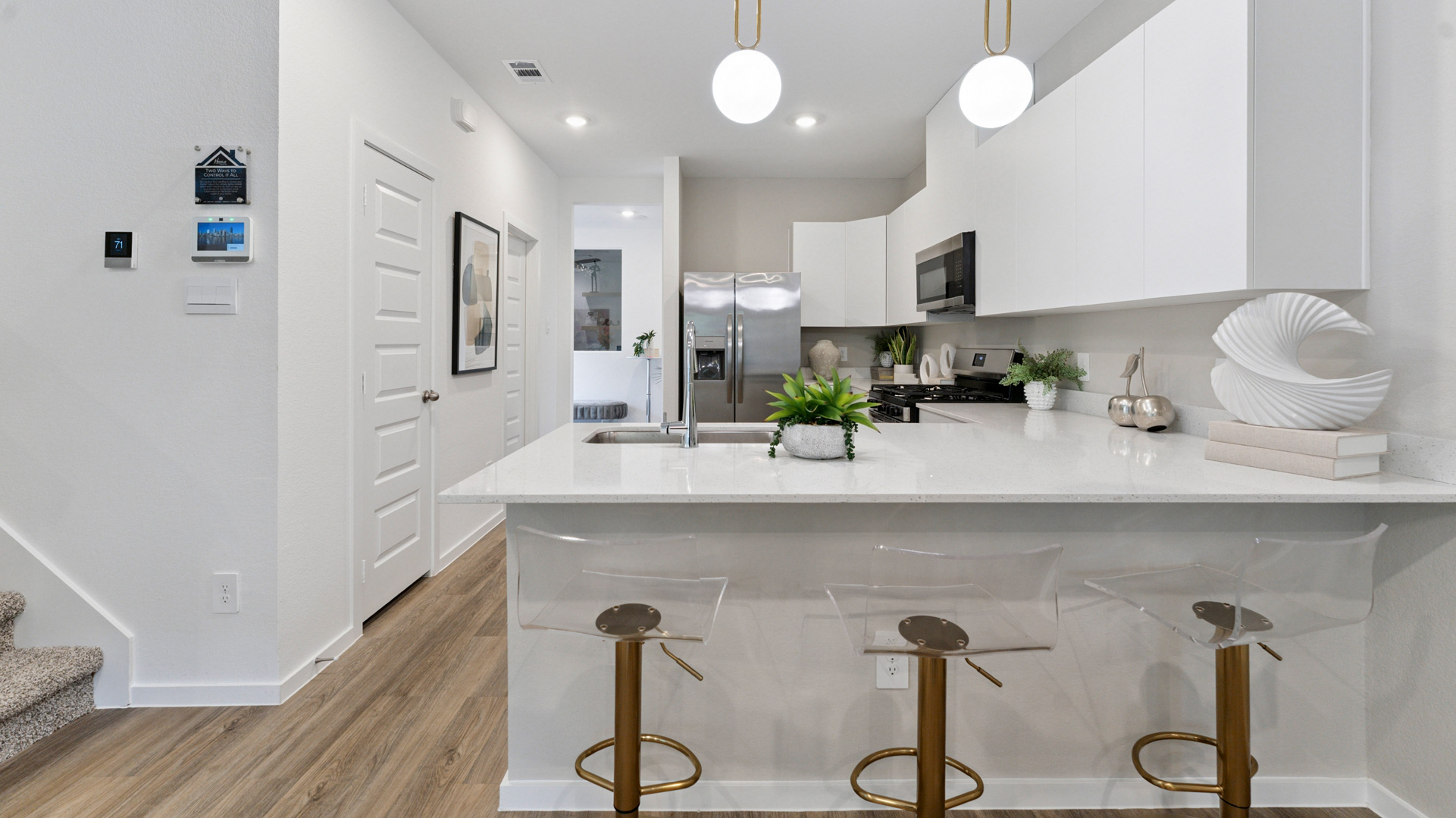 bar seating in the kitchen offers the perfect spot for dining or entertaining