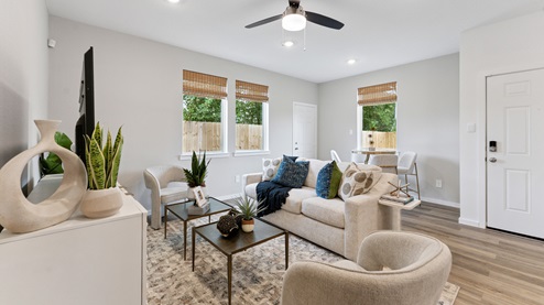 the living room and dining area are located in the rear of the home