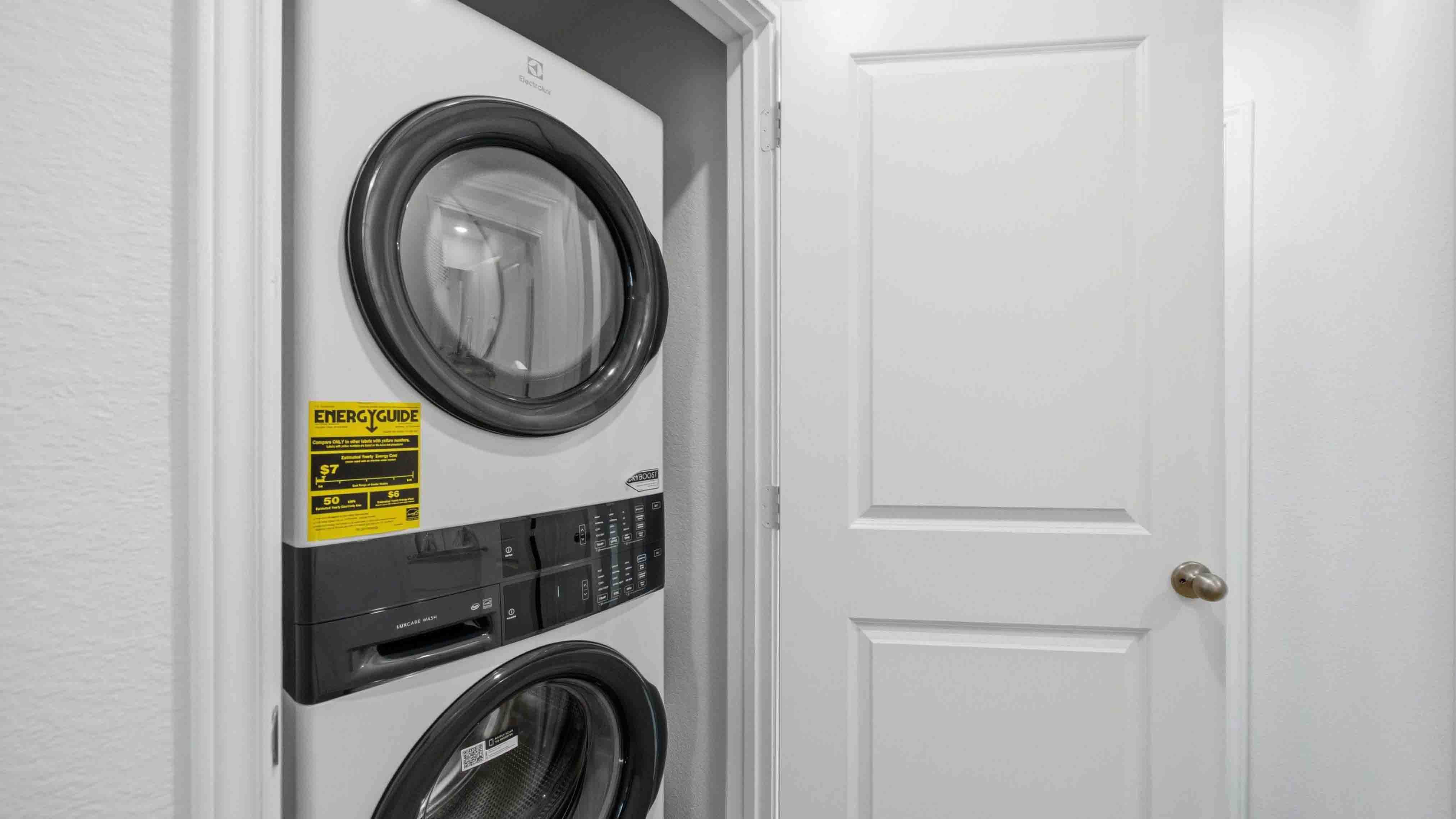 laundry closet with a washer and dryer