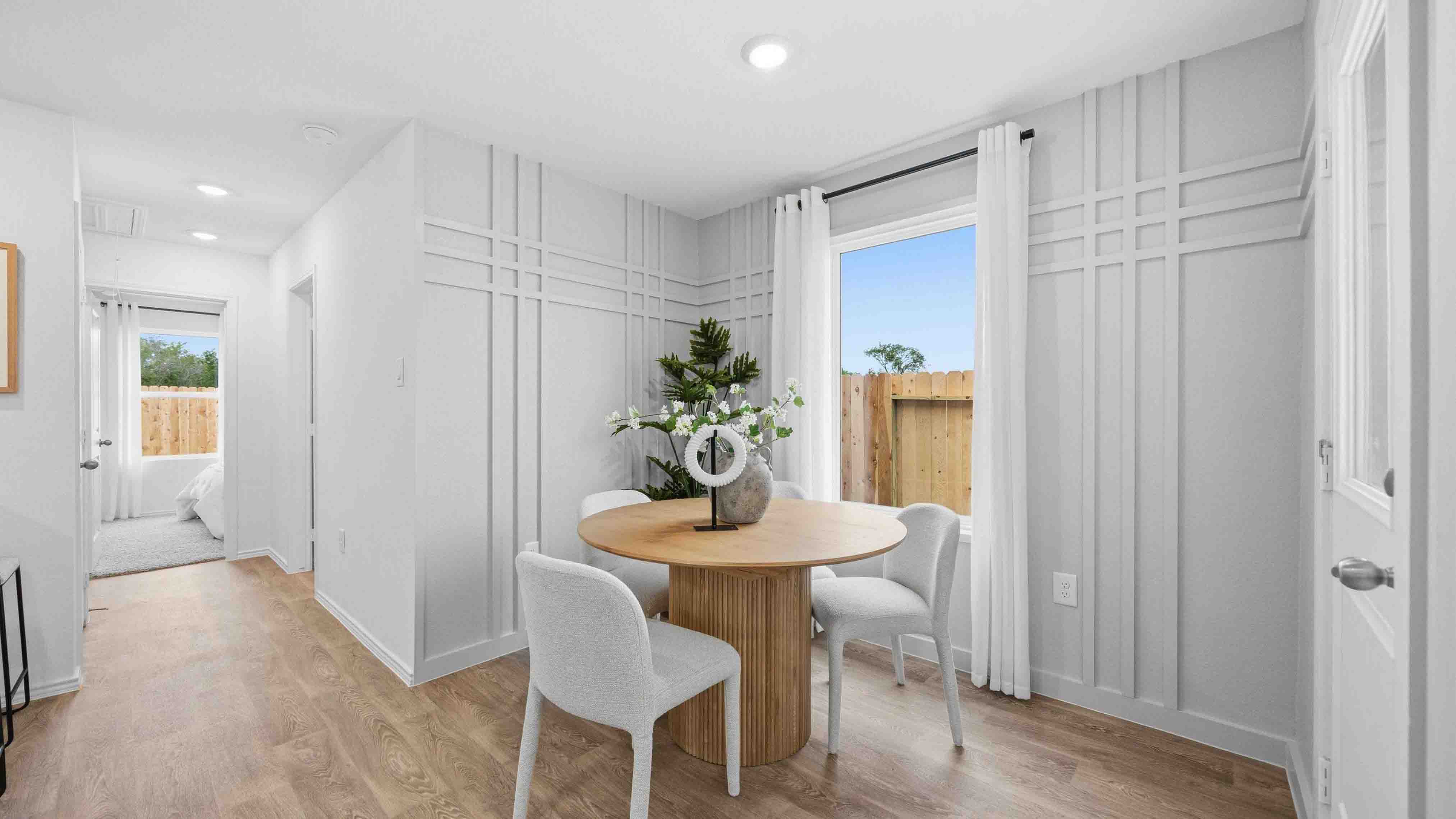dining room off the kitchen with a large window for natural lighting