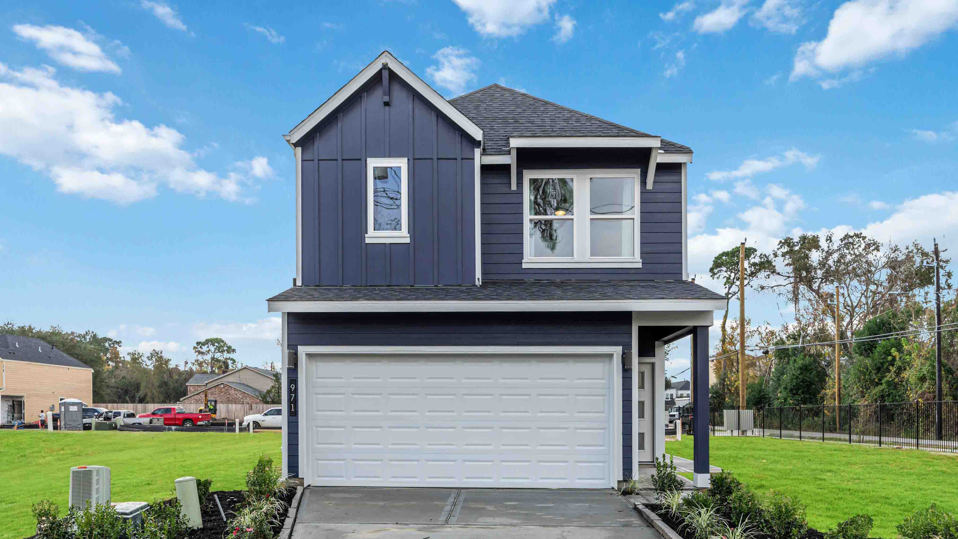 iris floor plan with a two car garage and a front entry