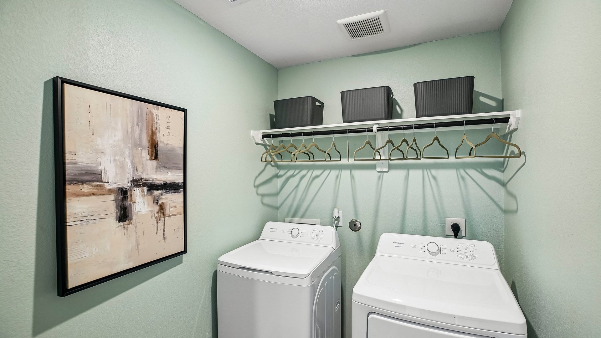 Dedicated laundry room providing convenient utility space and organization.