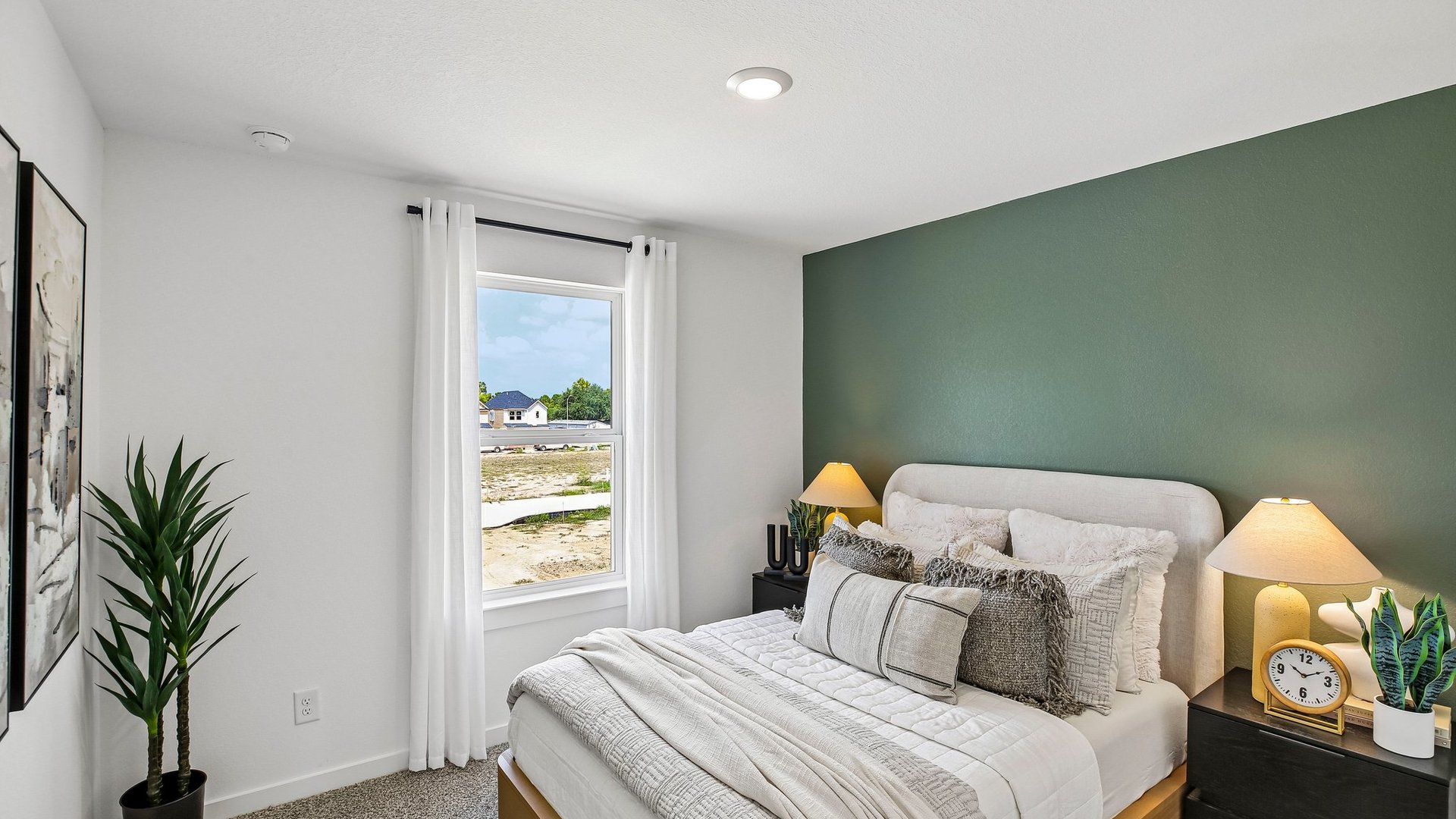 Secondary bedroom offering natural light and flexible space for family members or guests.