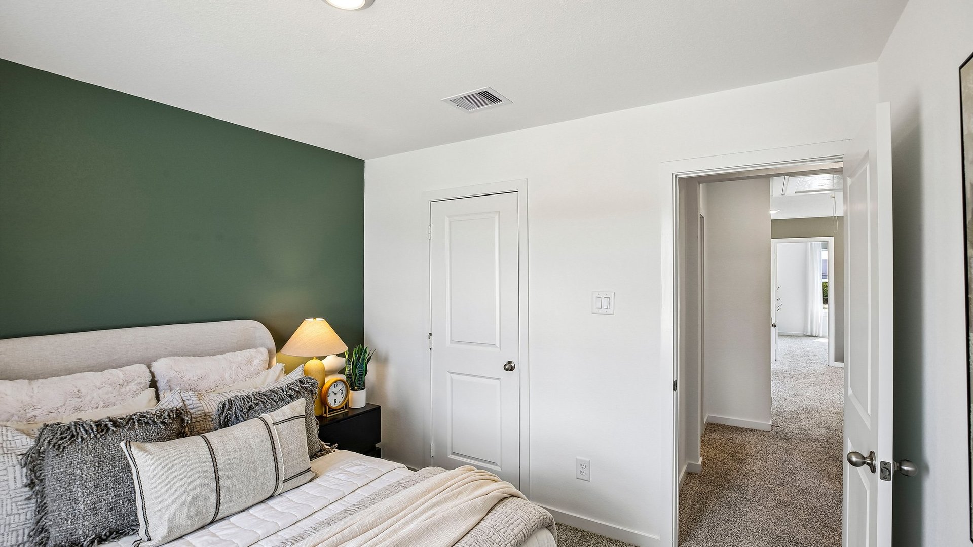 Secondary bedroom offering natural light and flexible space for family members or guests.