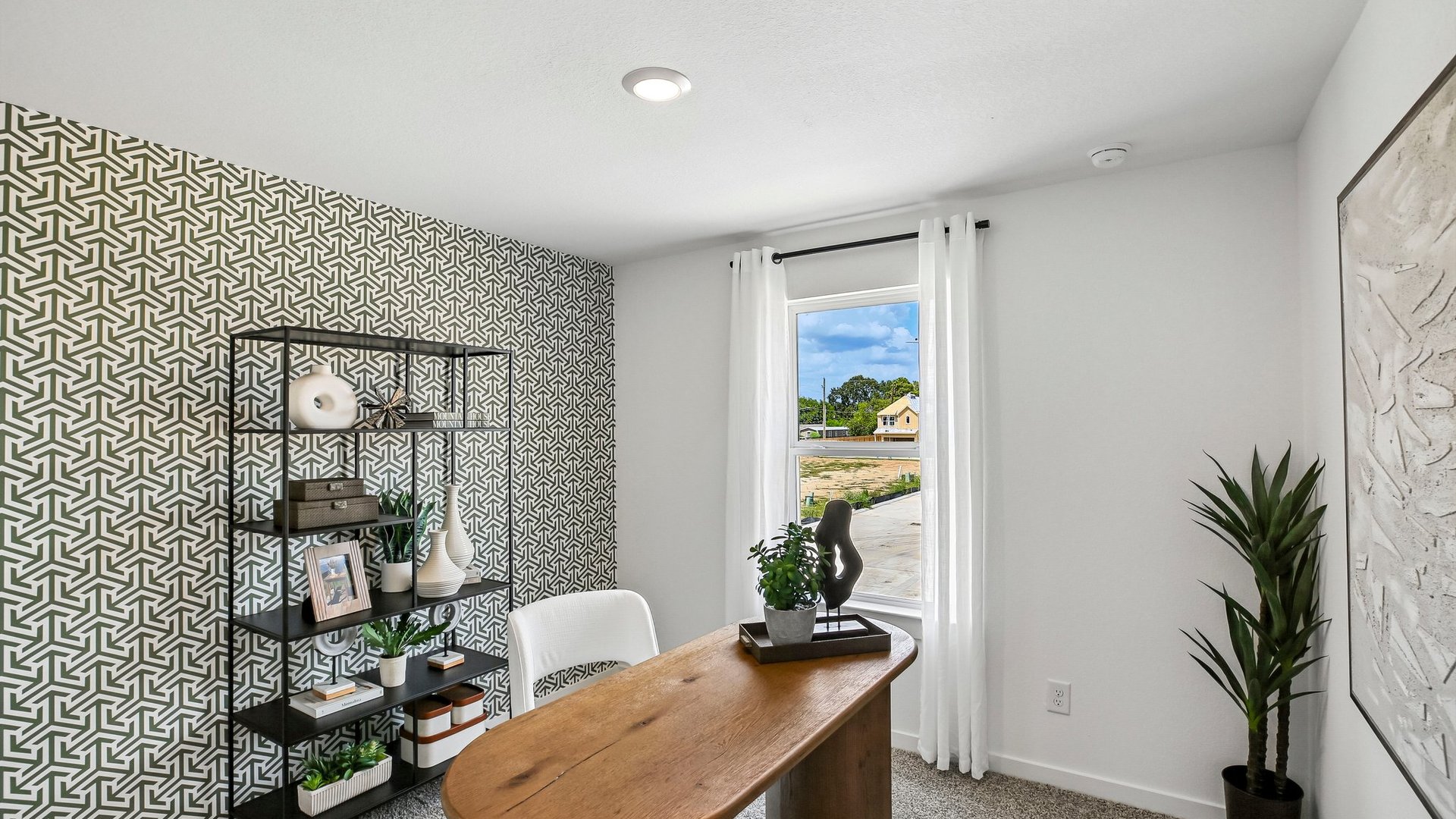 Flexible secondary room staged as a home office with space for productivity and remote work.