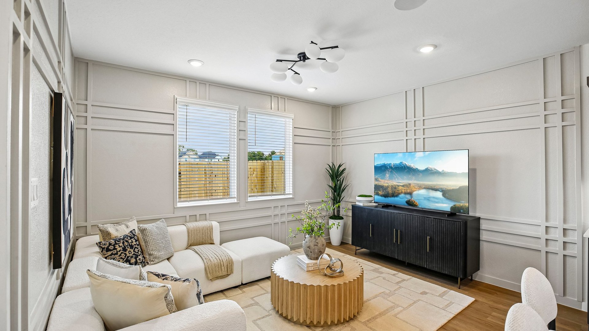 Open living room filled with natural light and contemporary finishes designed for everyday comfort.