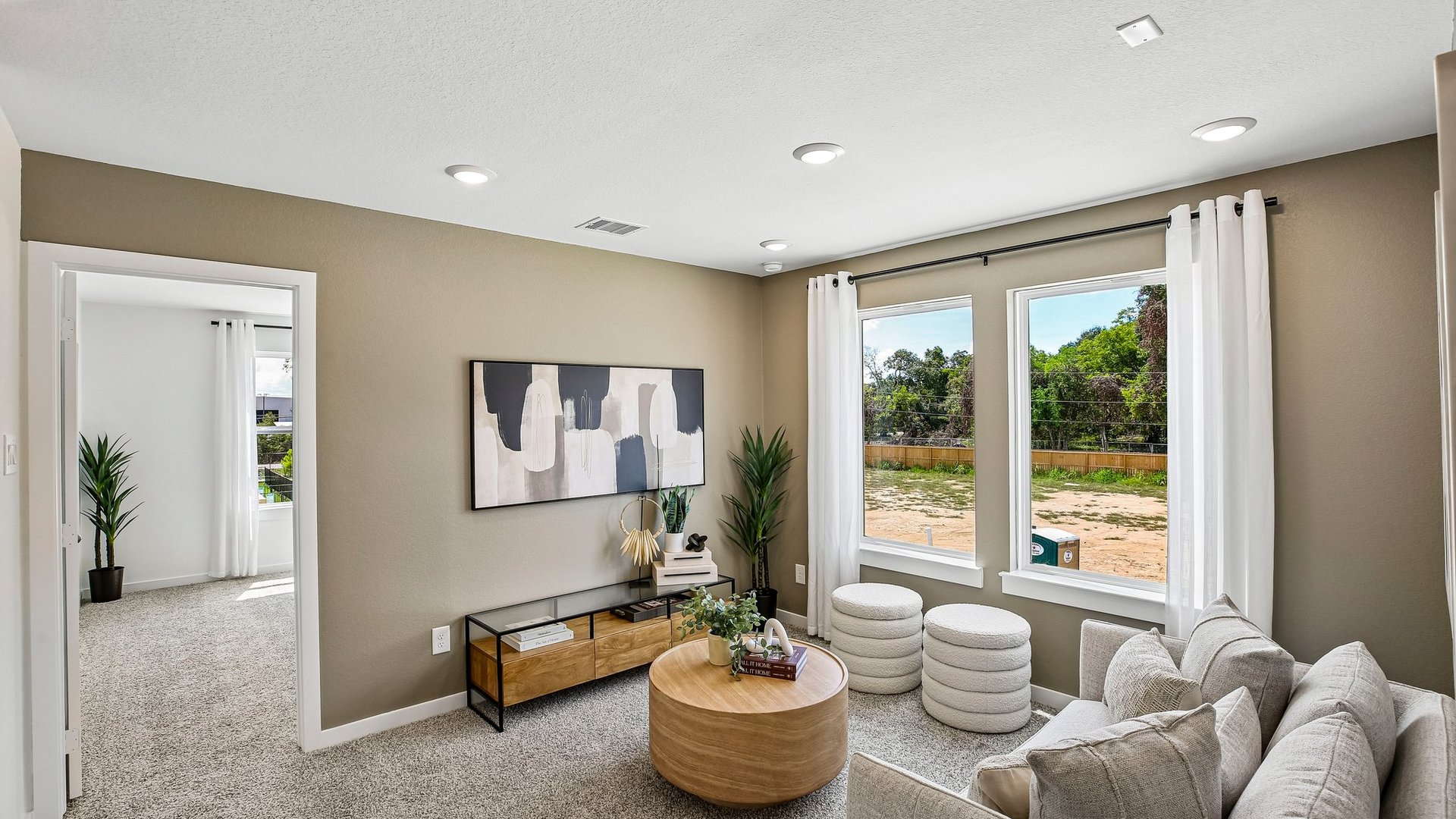 Versatile upstairs living space providing additional room for relaxation and entertainment.