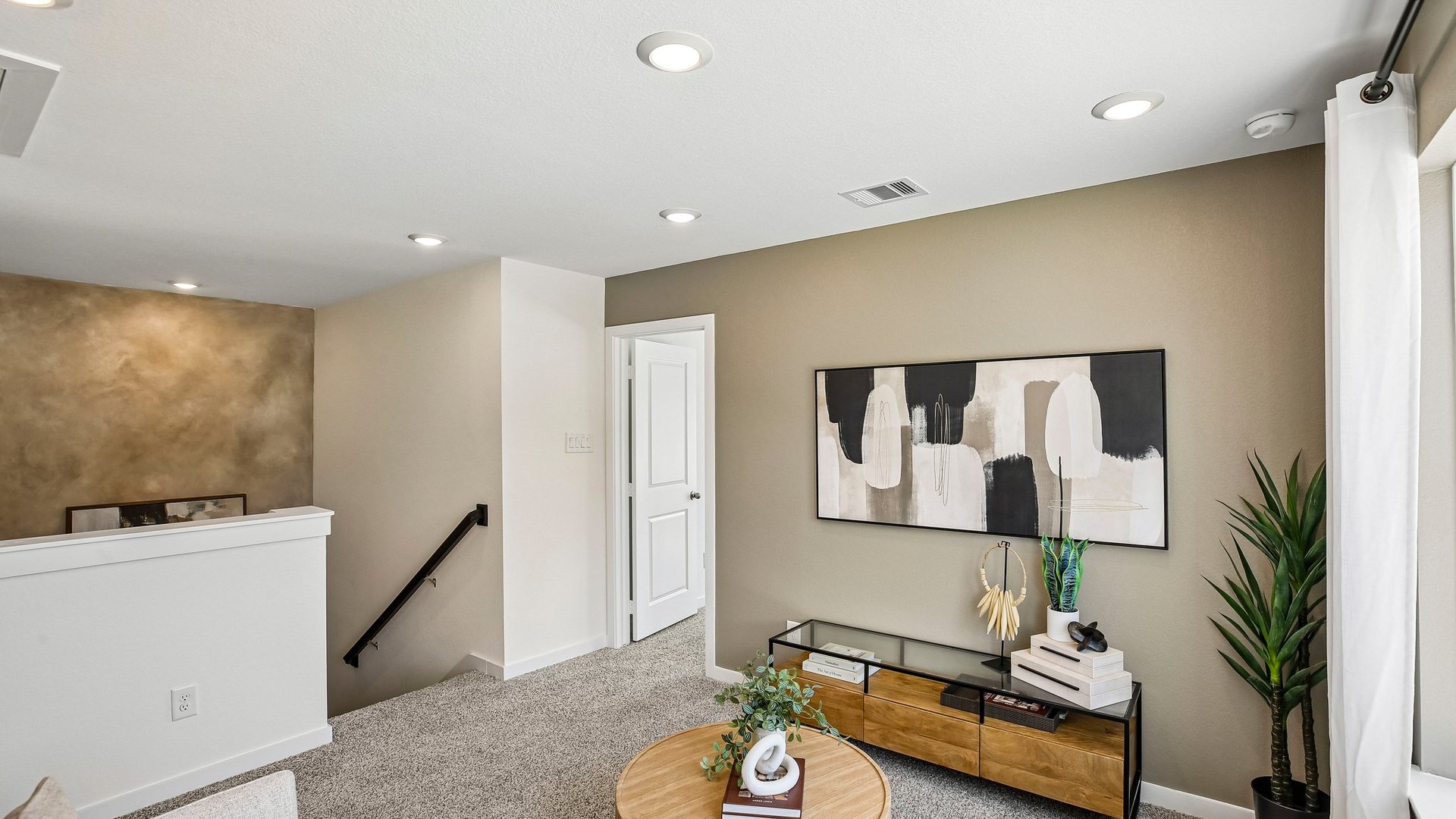 Versatile upstairs living space providing additional room for relaxation and entertainment.