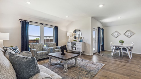 Open-concept living area with furniture and large window