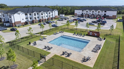 Creeks at Burnett Trail swimming pool with seating