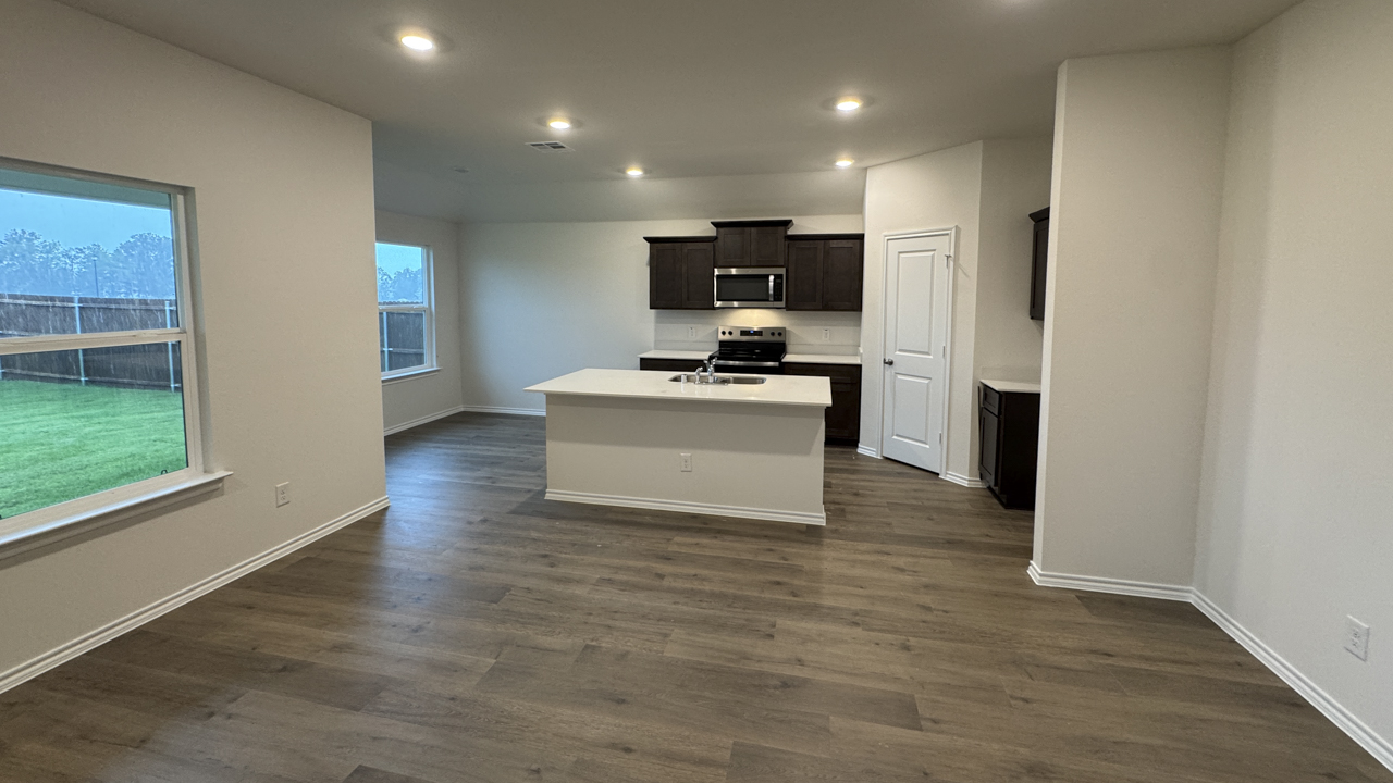 open concept living area with hardwood floors