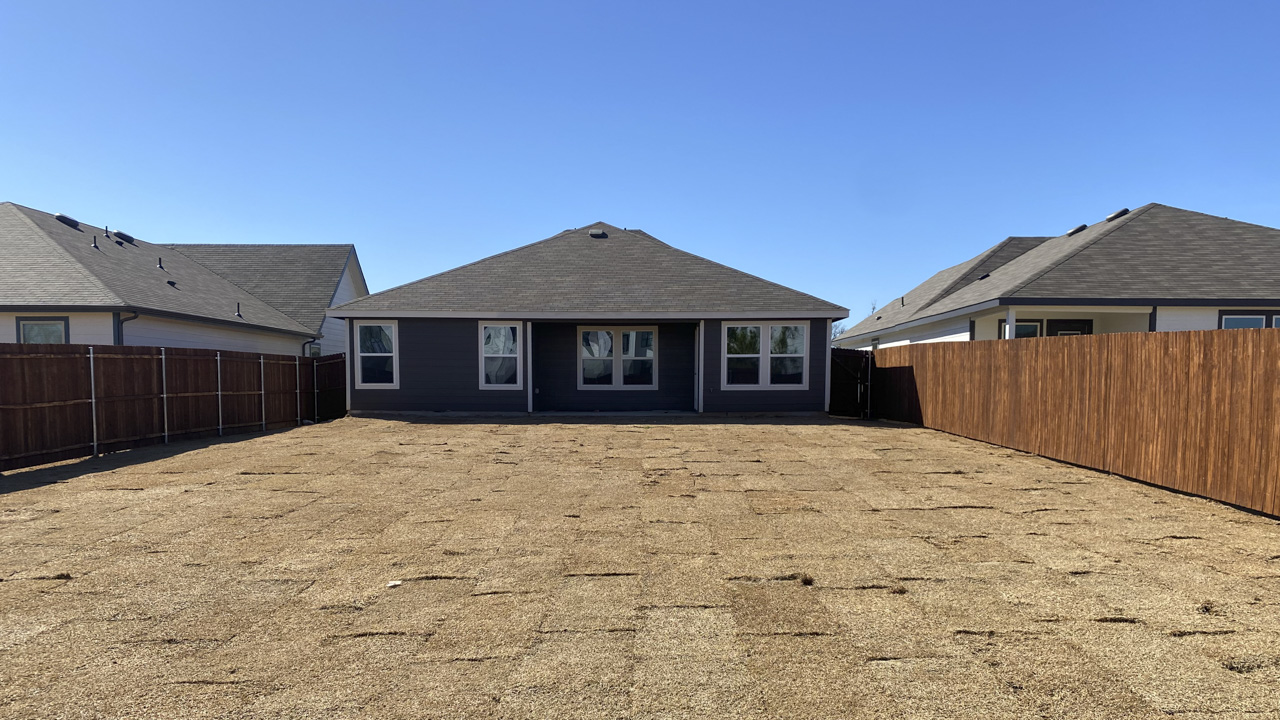 Large backyard with patio located in the middle