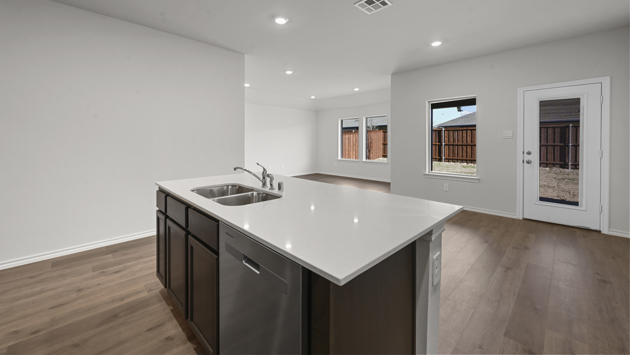 kitchen isalnd view with open floor plan to living room