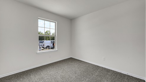 X40A secondary bedroom with carpet