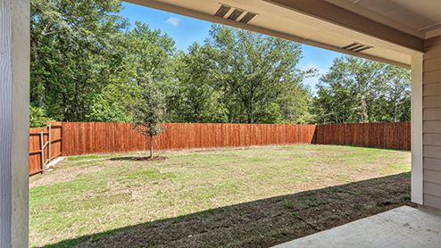 Rear exterior of home with covered back porch.