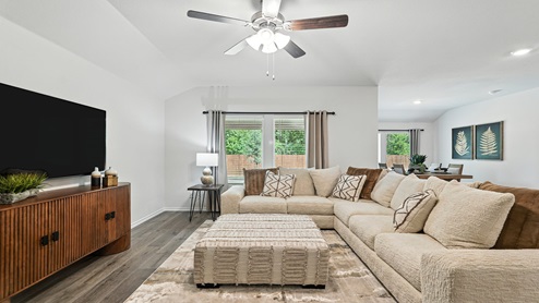 Living rooms with windows for natural lighting.