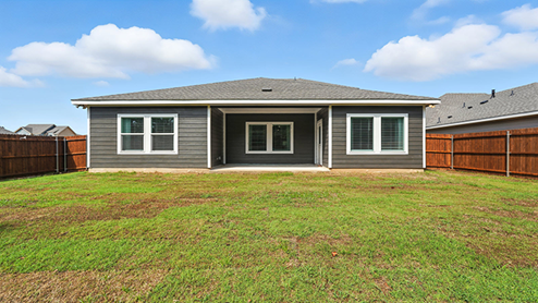 Rear exterior of home with covered back porch.