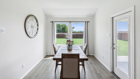 Huntsville model breakfast nook with table and large windows