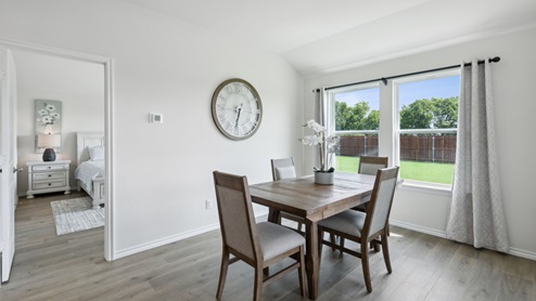 Huntsville model breakfast nook with table and large windows
