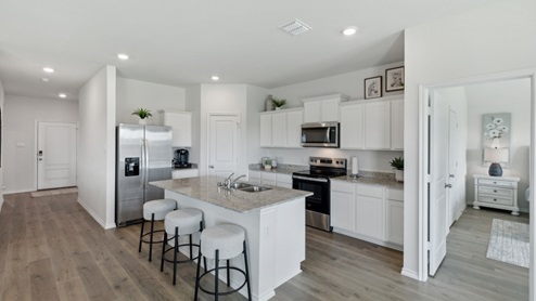 Huntsville model kitchen with white cabinets and large island