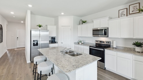 Huntsville model kitchen with white cabinets and large island