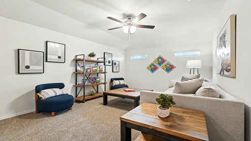 Loft area with carpeted floors.