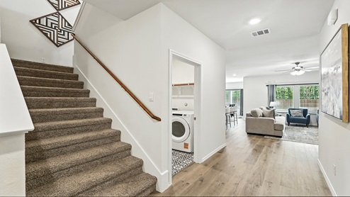 Carpeted stairs with direct access to upstairs.