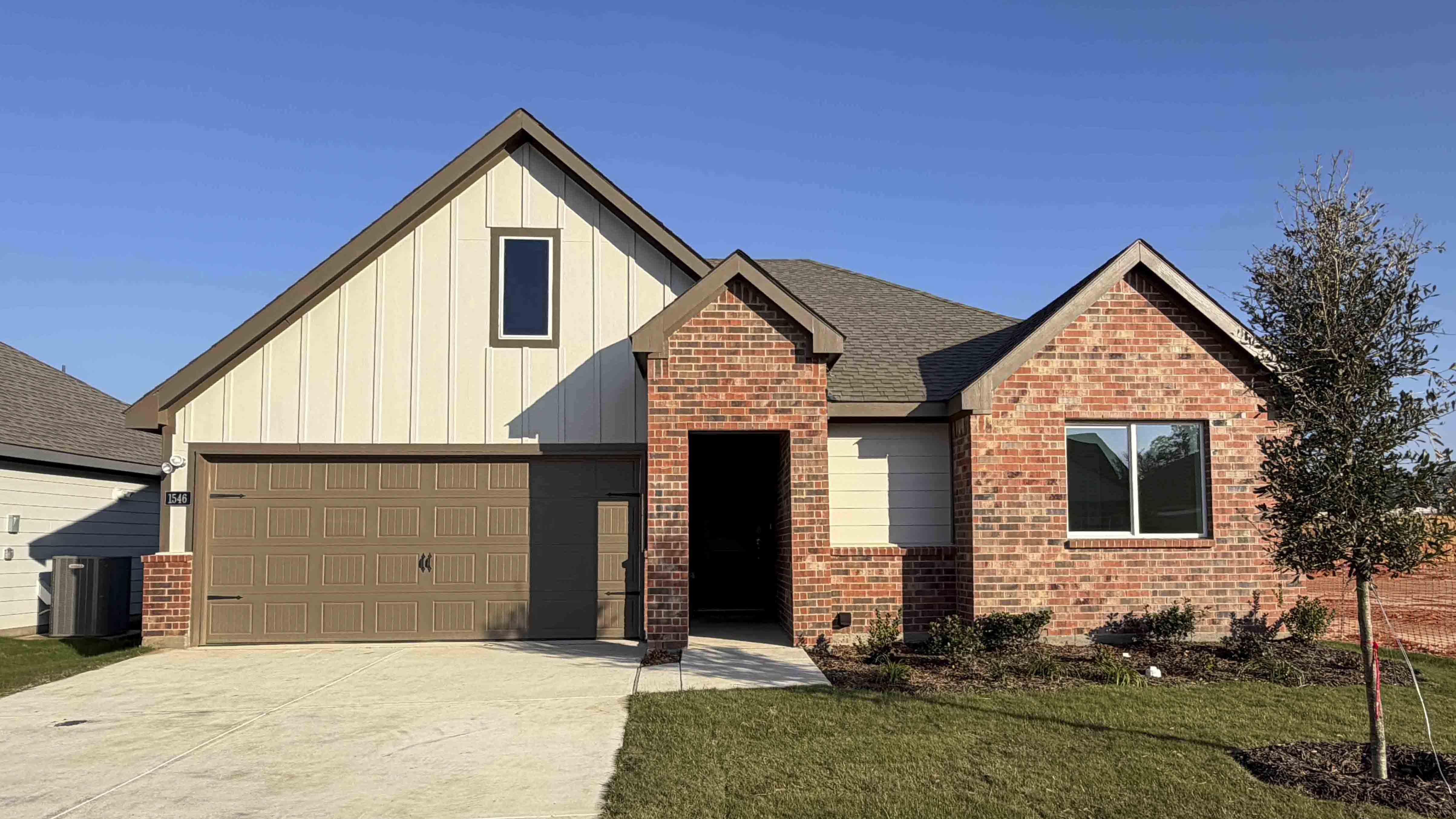 exterior of one story home with siding and brick exterior