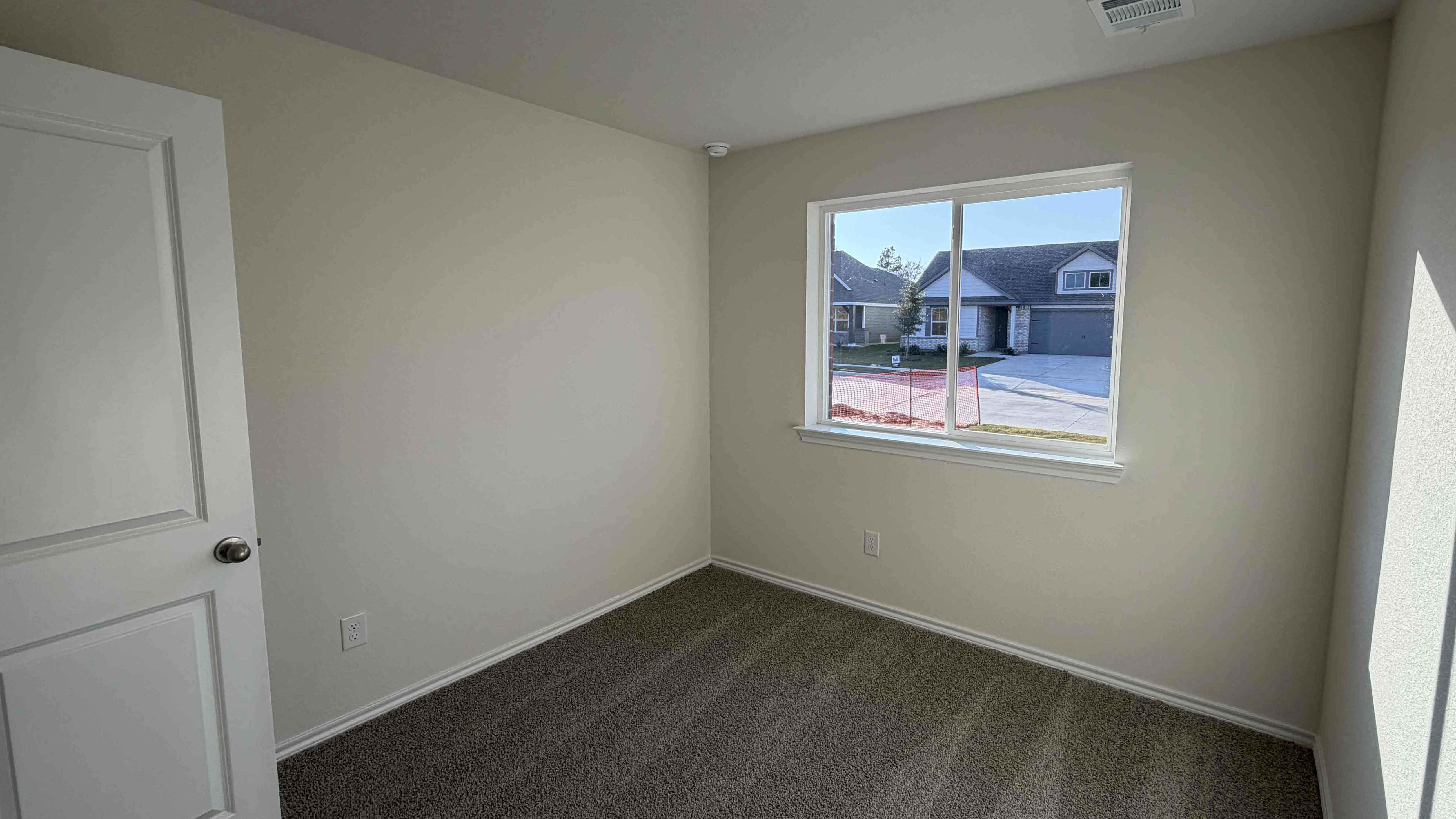 secondary bedroom with large window