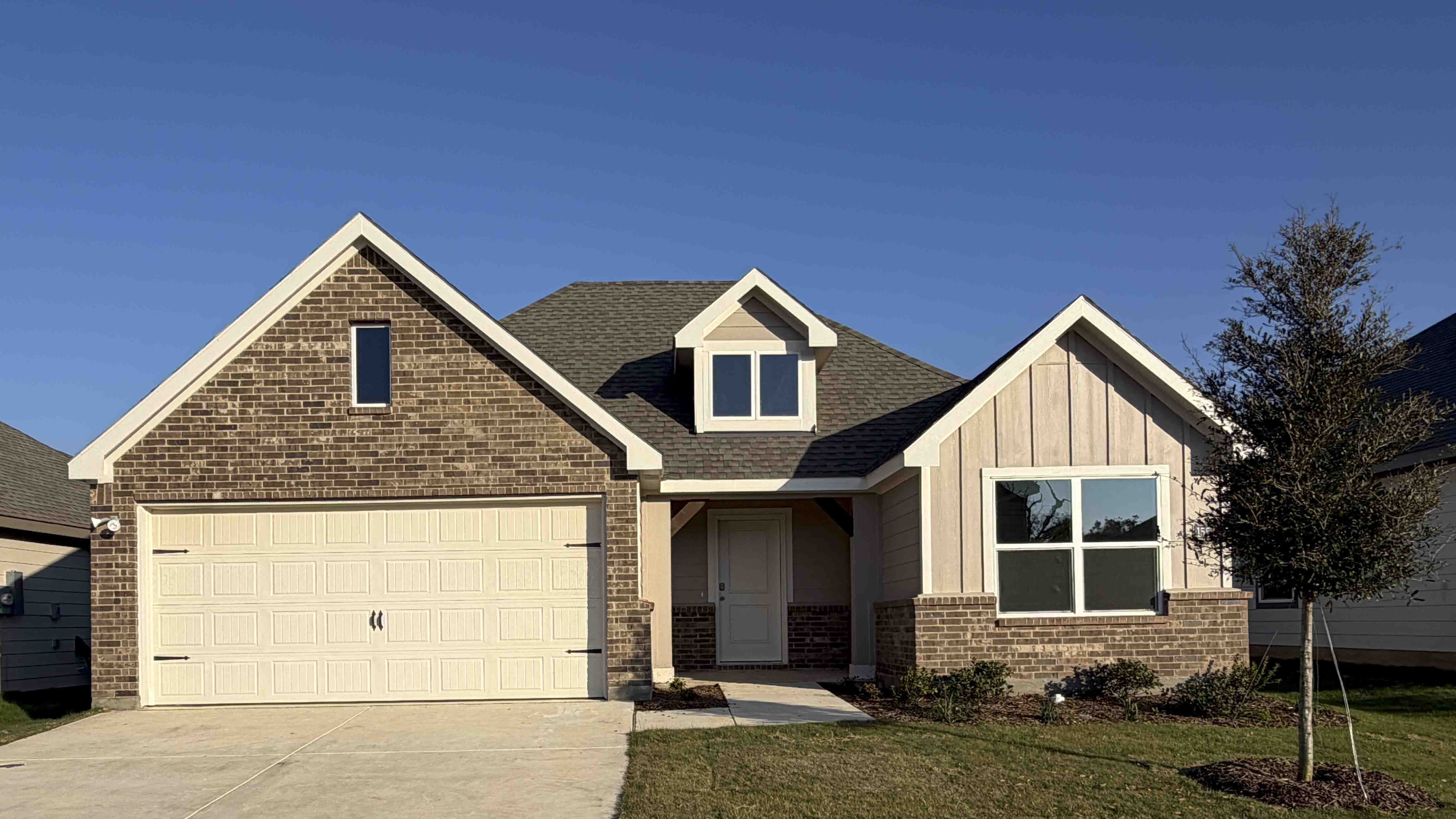exterior of home with brick and siding