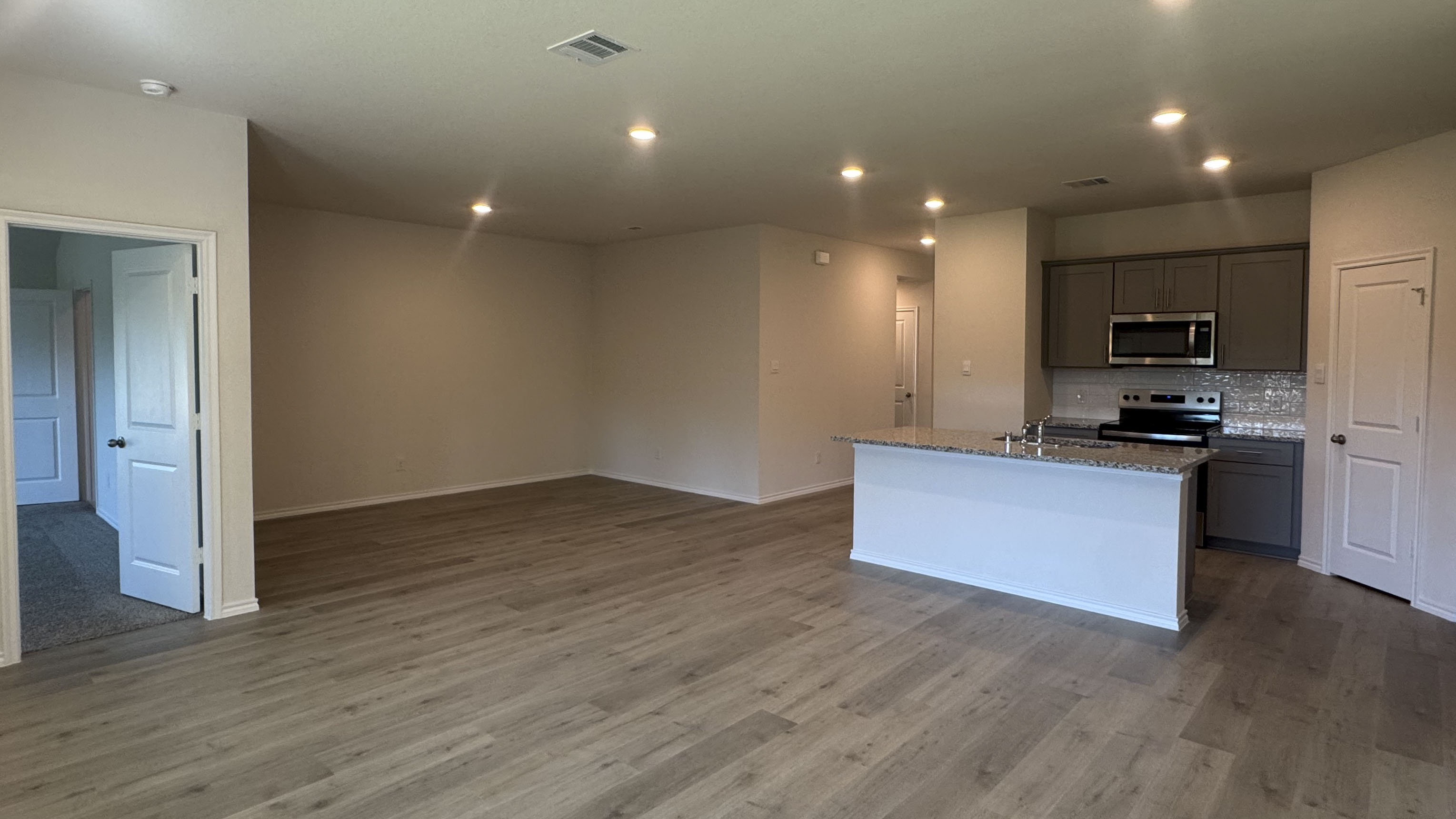 open concept living area with hardwood floors